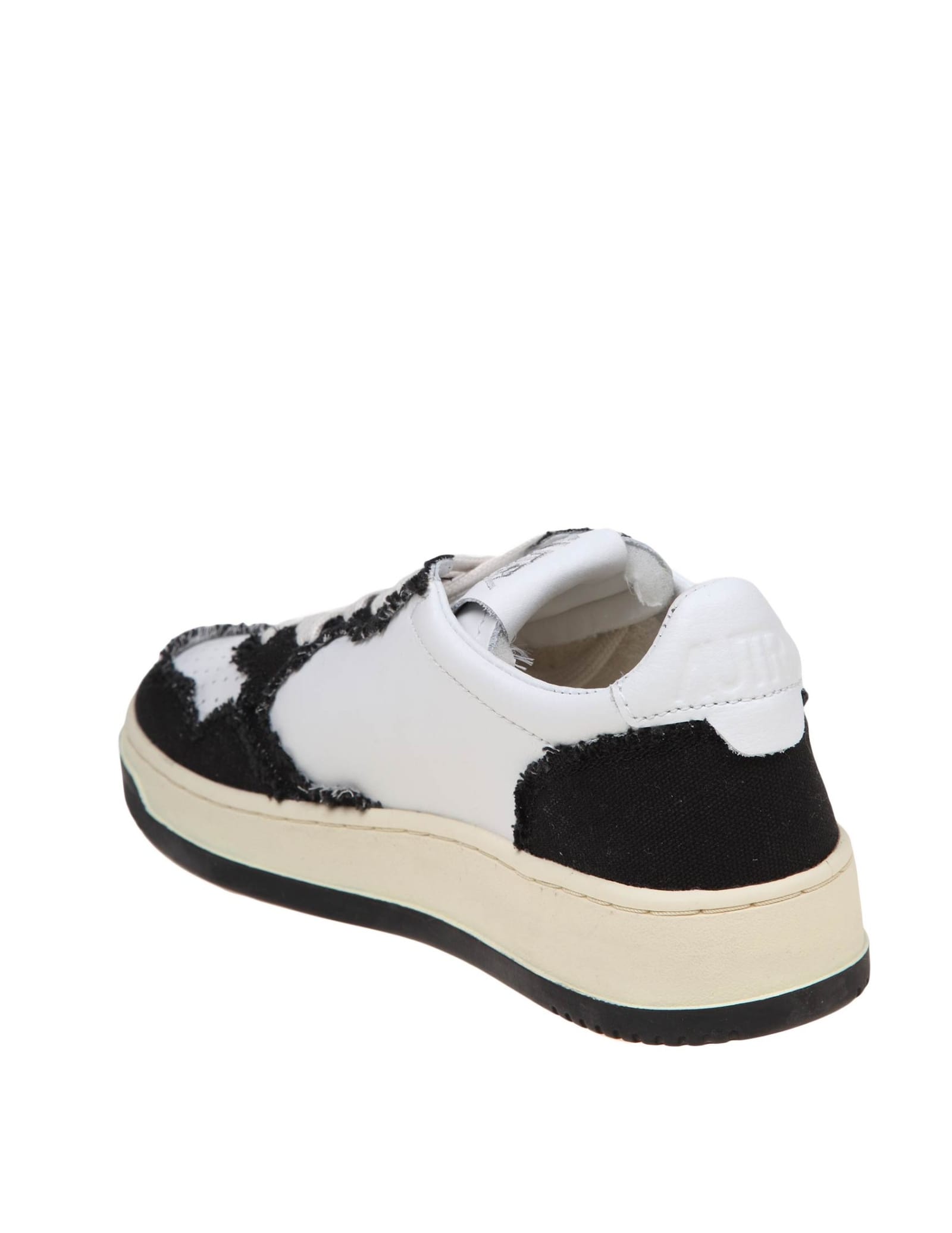 Shop Autry Sneakers In Black And White Leather And Canvas In White/black
