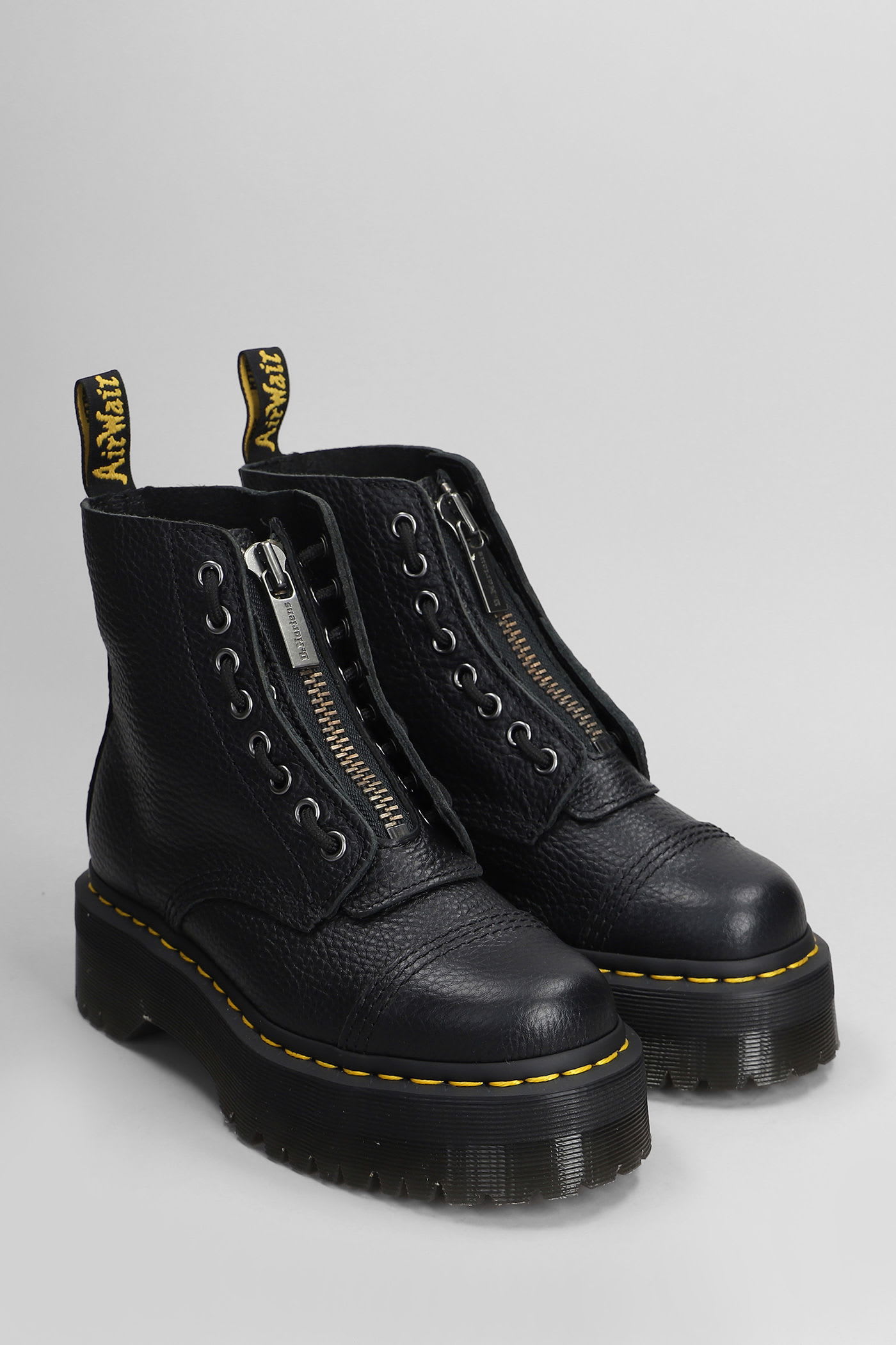 Dr. Martens Sinclair Combat Boot In Black Hammered Leather With A Large Treaded Sole In Animal Print