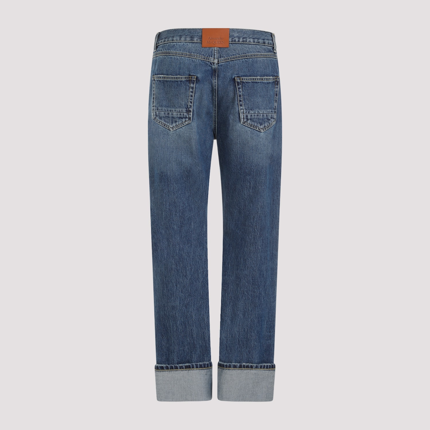 Shop Alexander Mcqueen Turn Up Jeans In Blue Washed