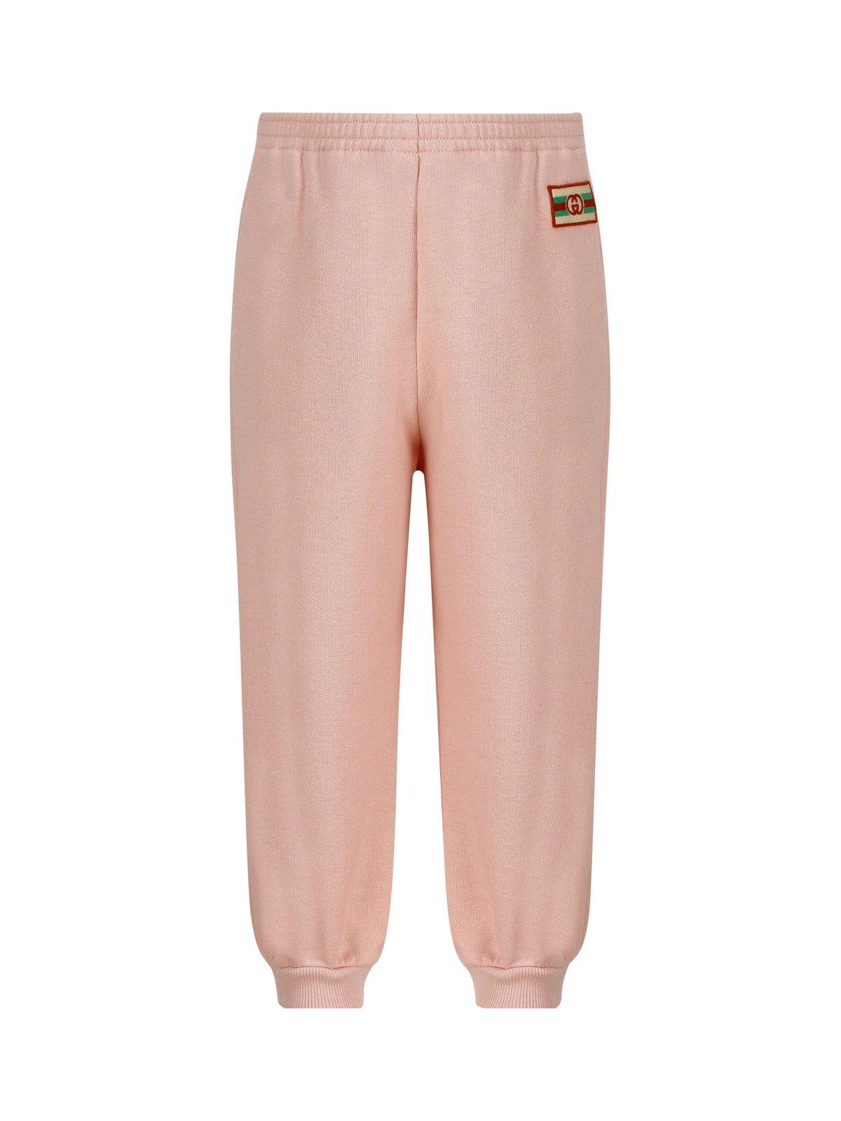 Shop Gucci Logo Patch Tapered Track Pants In Pink
