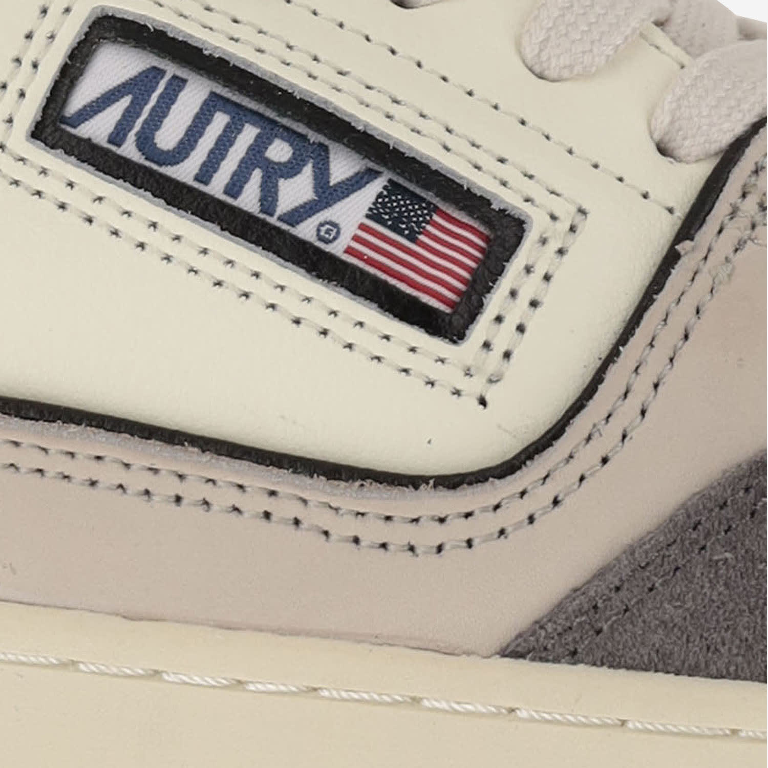 Autry Low-top Sneakers With Textured Panels And Cushioned Sole In Black/gray