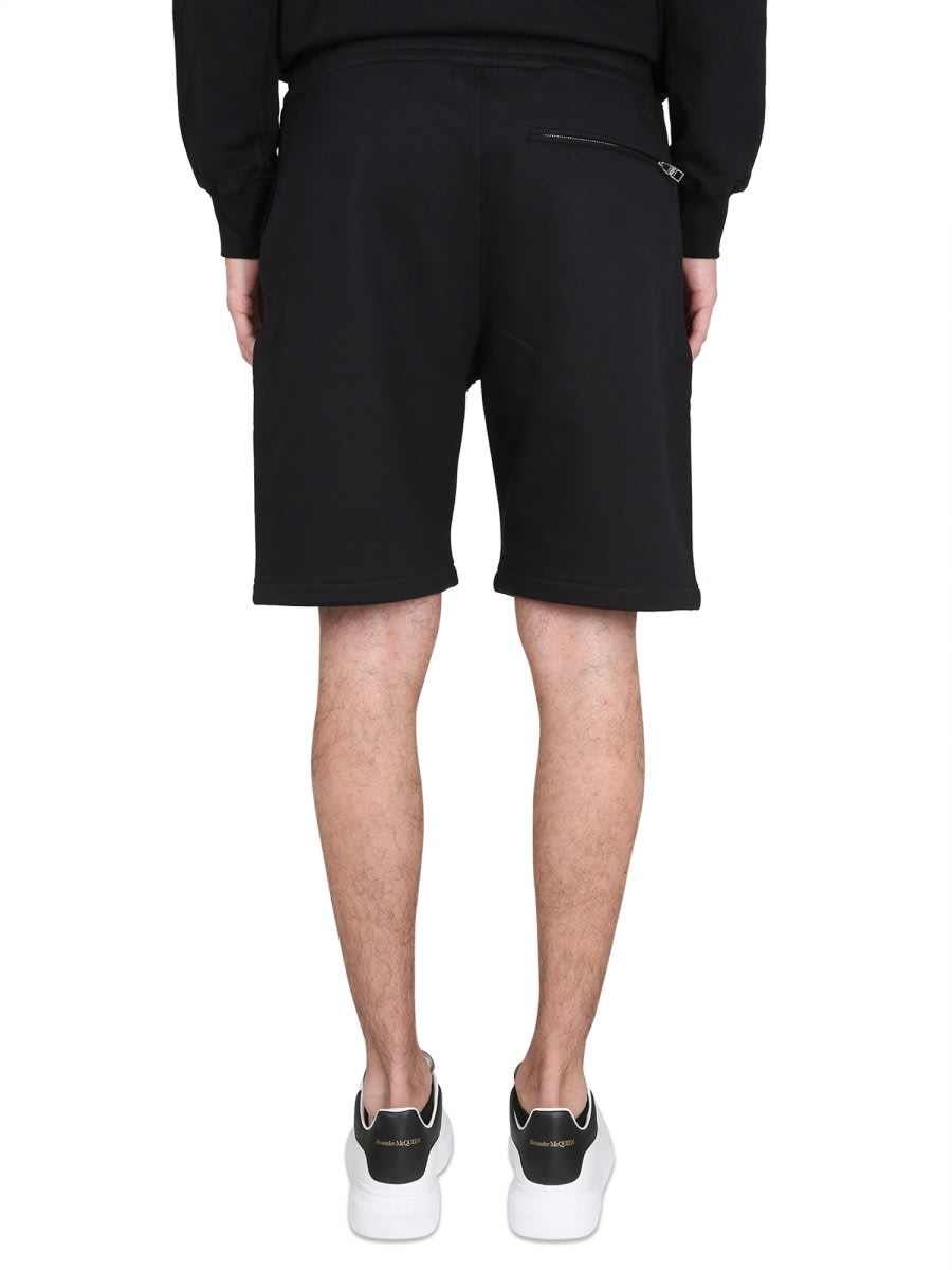 Shop Alexander Mcqueen Bermuda Shorts With Graffiti Logo Print In Black Ivory