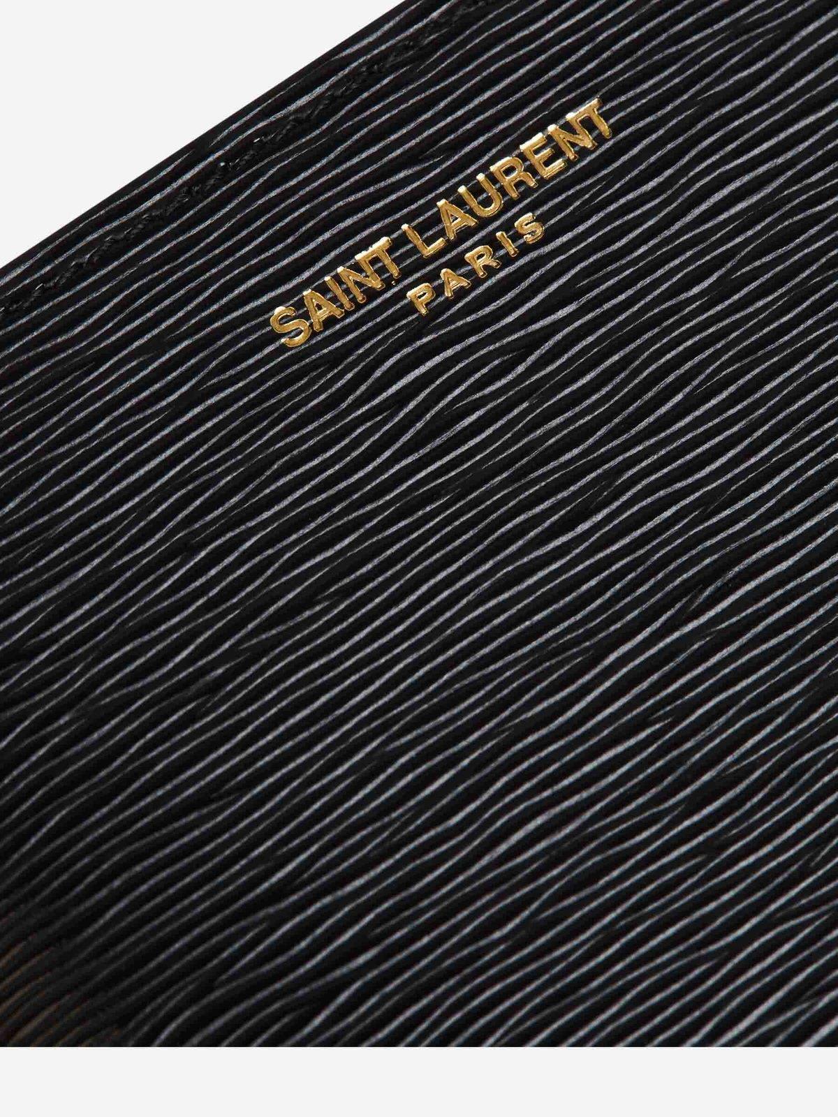 Shop Saint Laurent Logo Engraved Bifold Wallet In Black