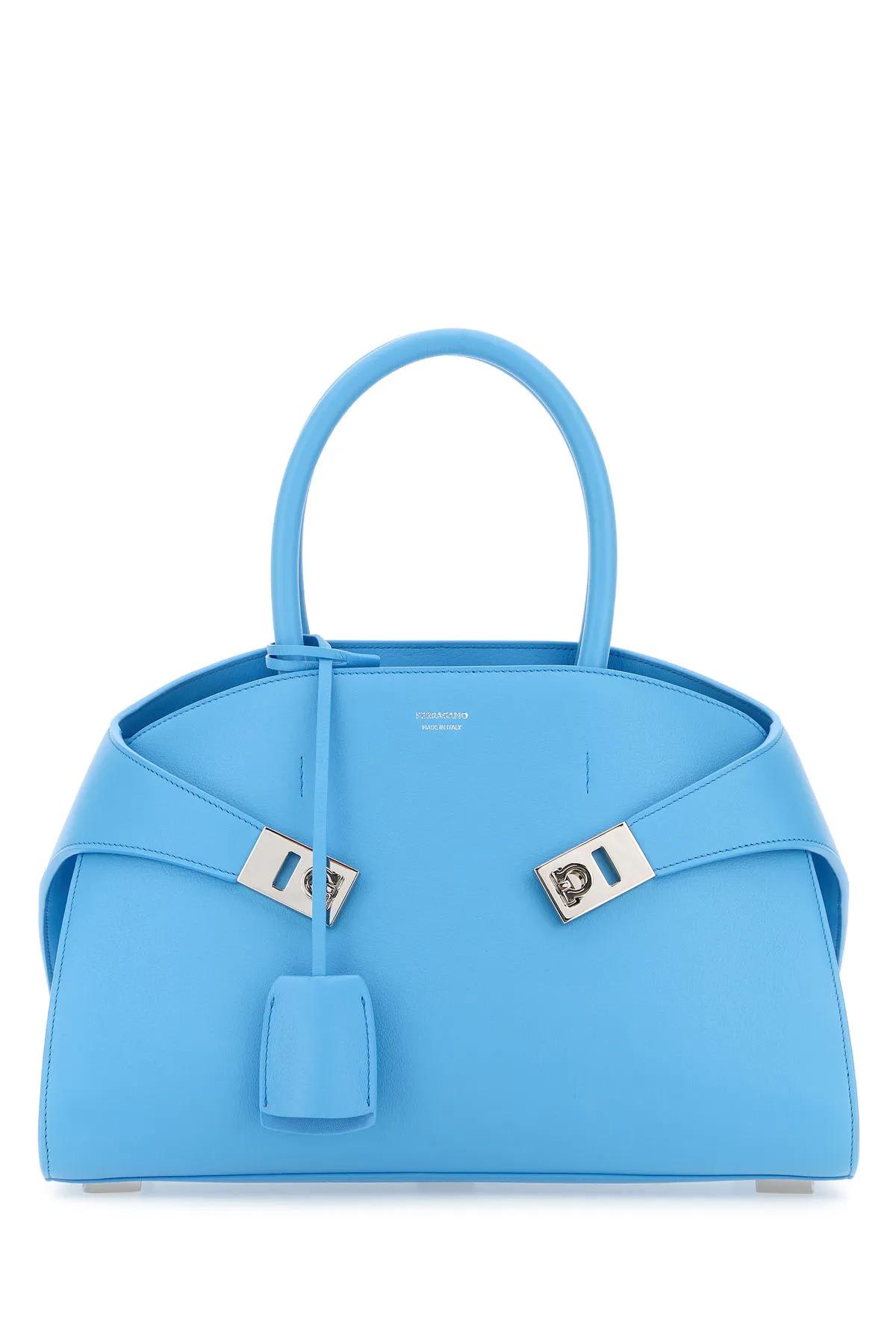 Shop Ferragamo Turquoise Leather Small Hug Handbag In Gnawed Blue