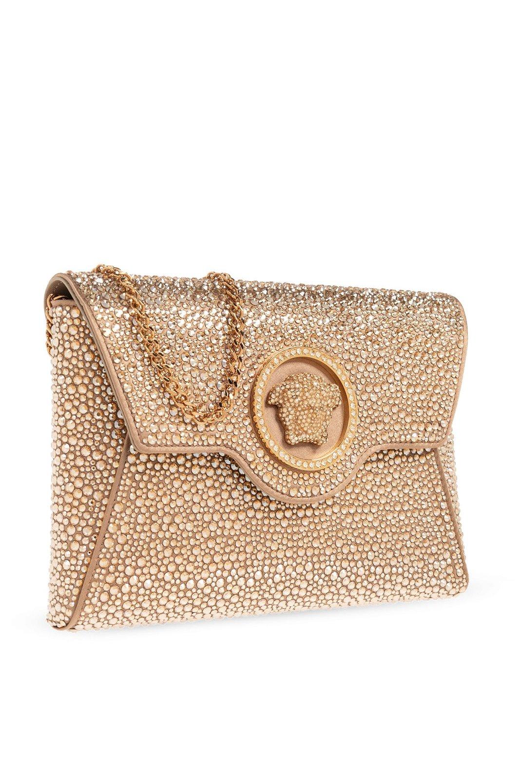 Shop Versace Medusa Plaque Embellished Clutch Bag In Neutrals/gold