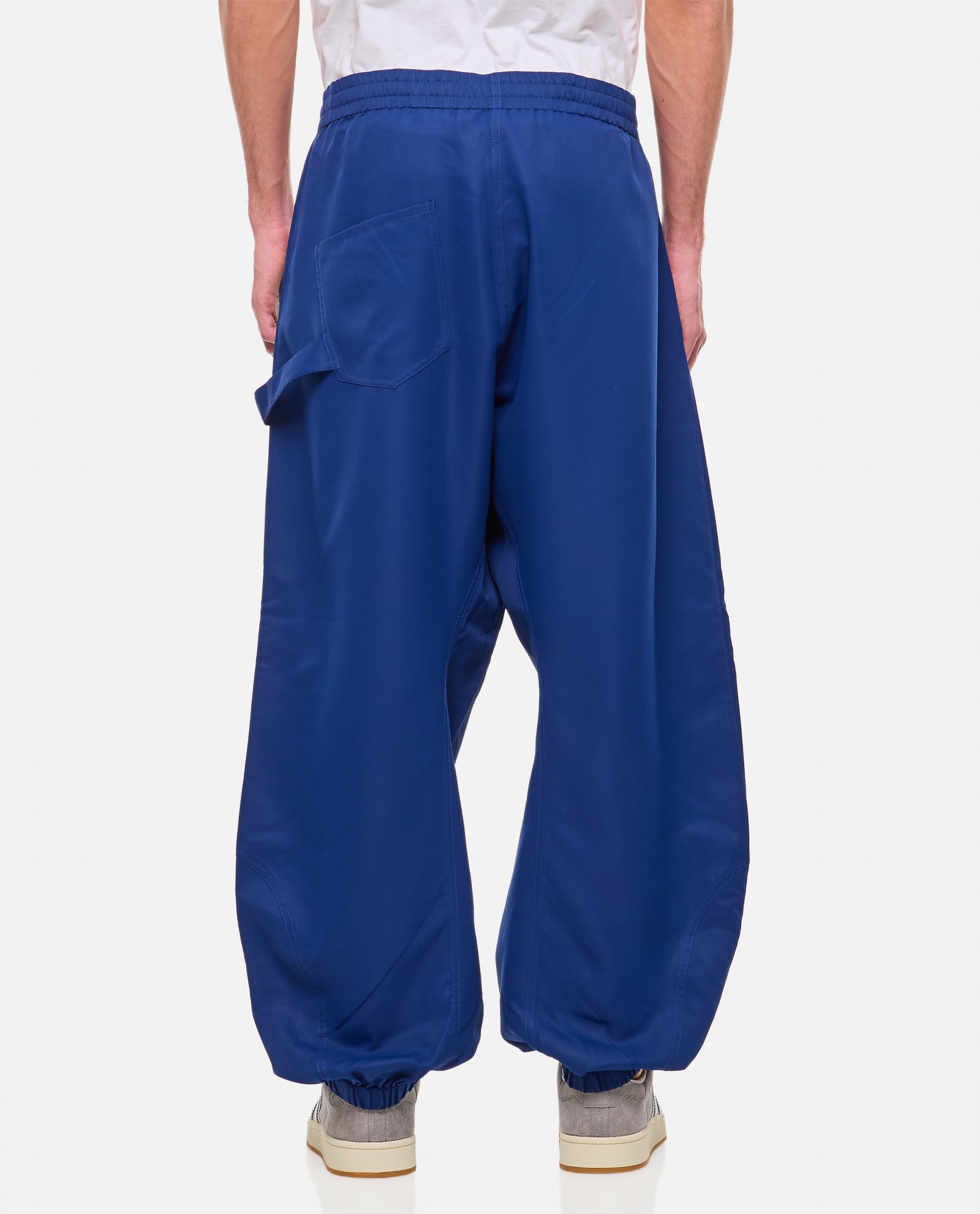 Shop Jw Anderson Twisted Joggers In Blue