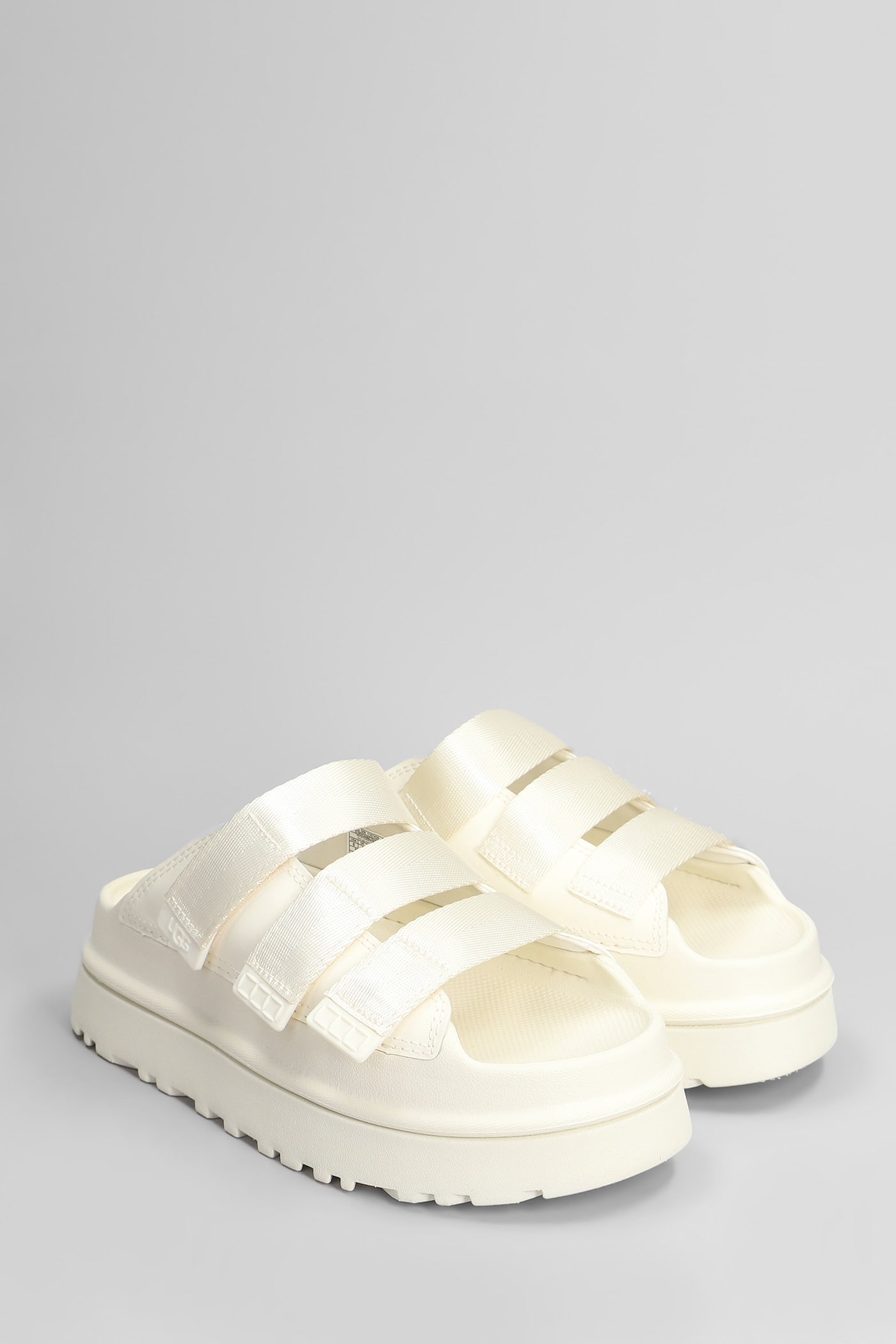 UGG GOLDENGLOW SLIDE SLIPPER-MULE IN BEIGE RUBBER/PLASIC