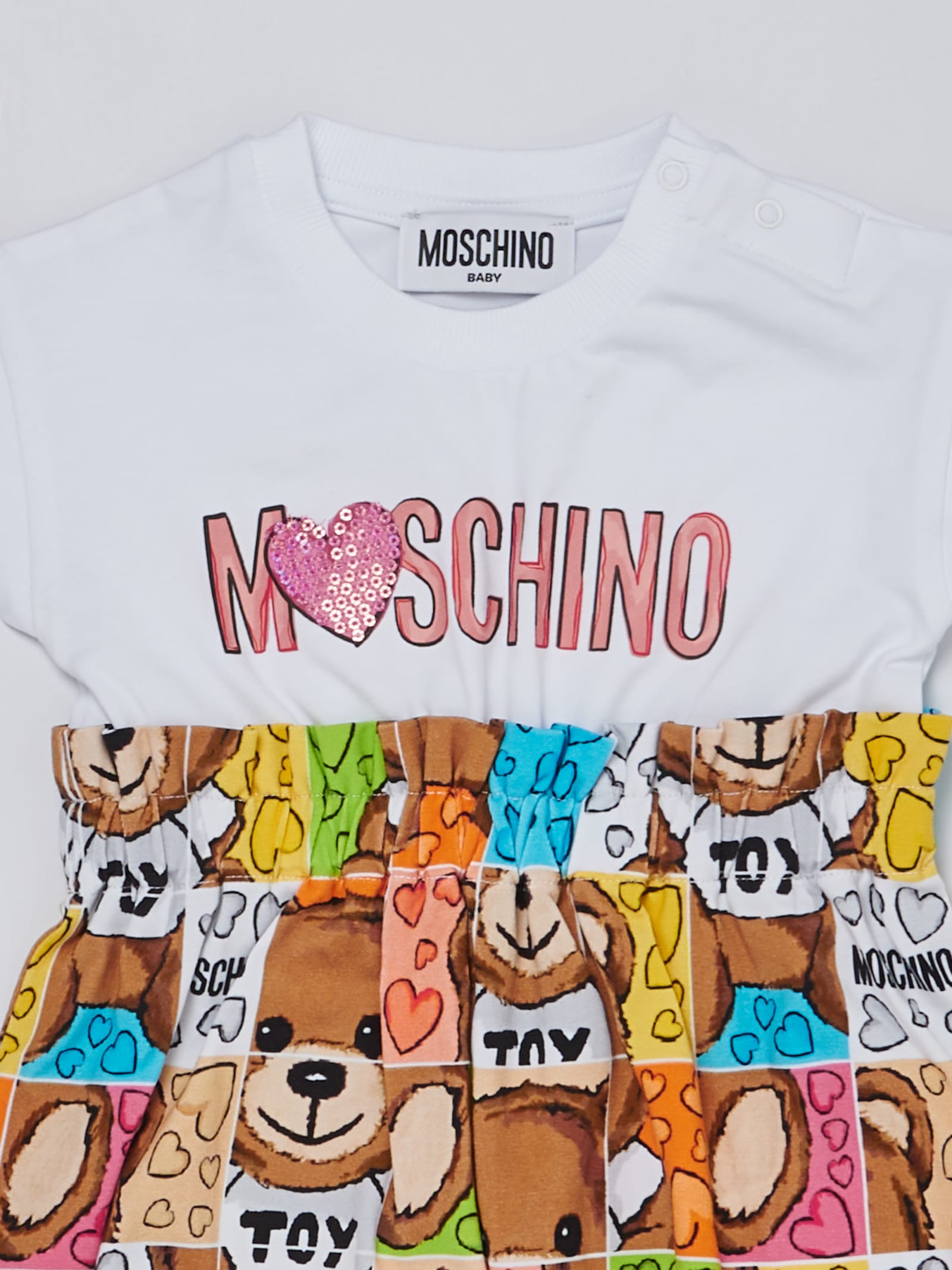 Shop Moschino Romper Jump Suit In B.co-multicolor