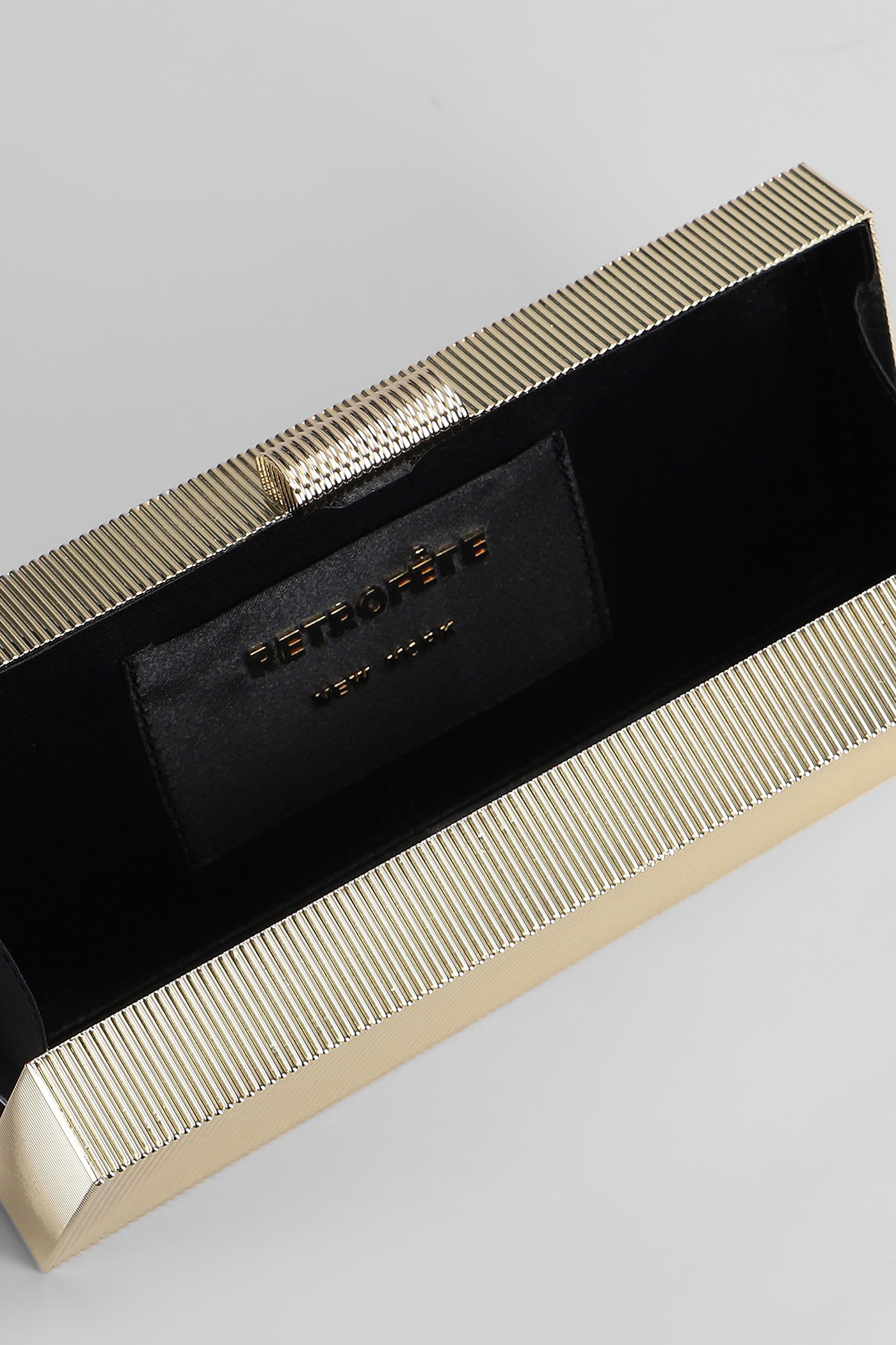 Retroféte Milo Clutch In Gold Metal Alloy In Black