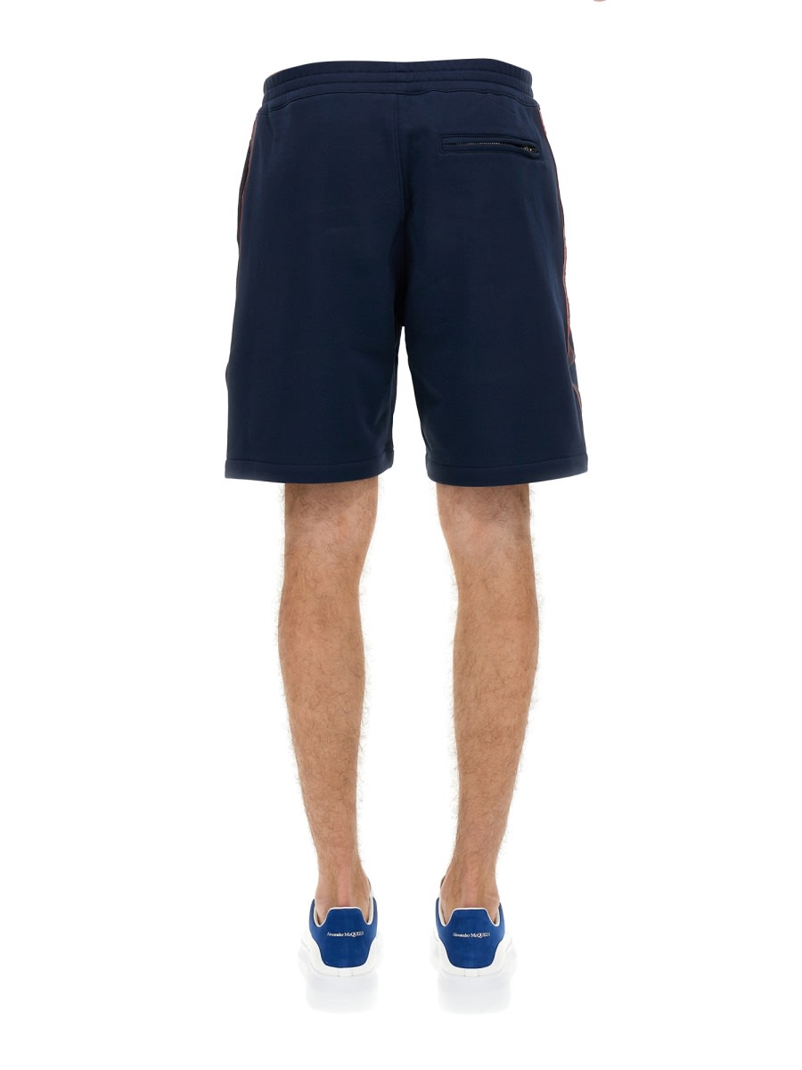 Shop Alexander Mcqueen Bermuda Shorts With Selvedge Logo Band In Blue