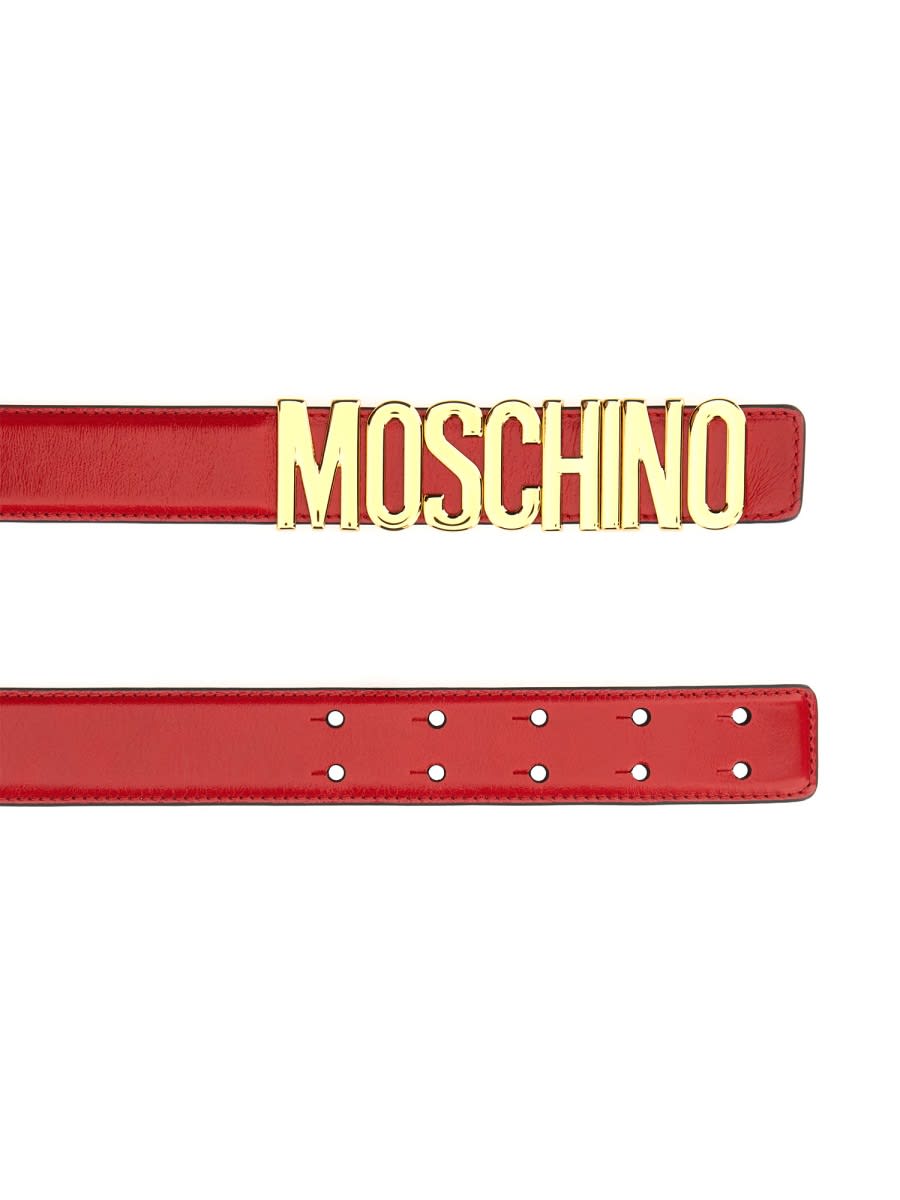 Moschino Adjustable Logo Embossed Leather Belt In Red