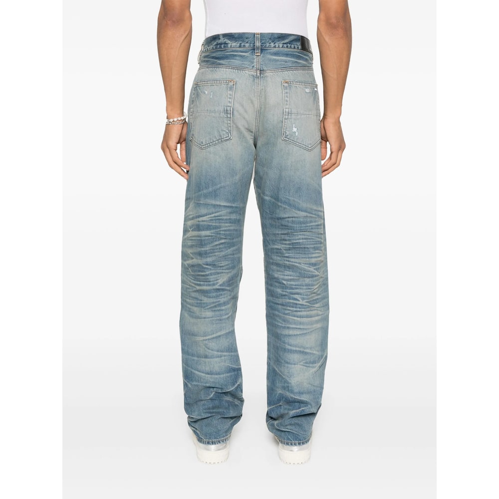Amiri Men Blue Jeans With Ripped Details On The Front And Logo Patch On The Rear In Denim Man In Blue