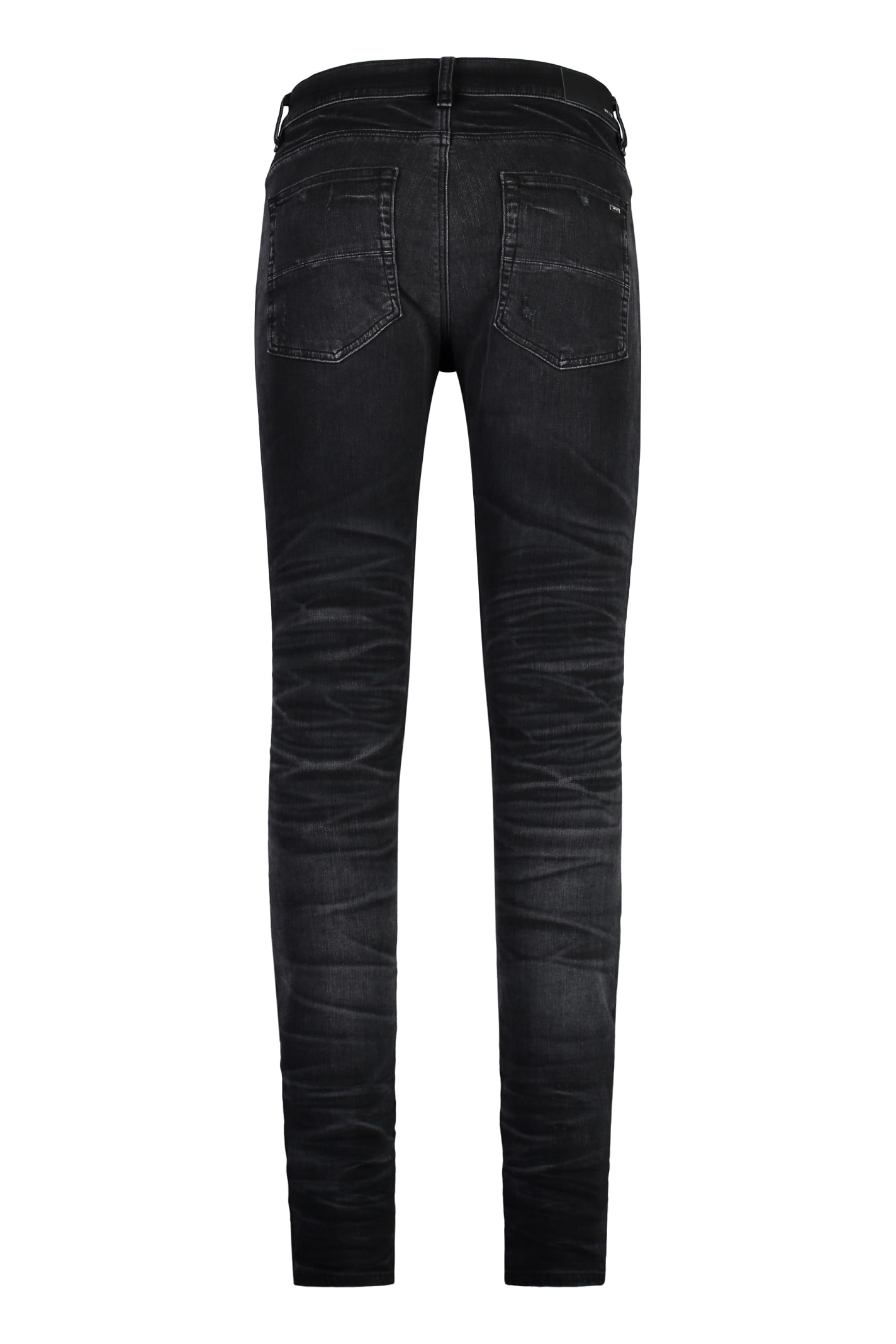 Shop Amiri Stack Skinny Jeans In Black