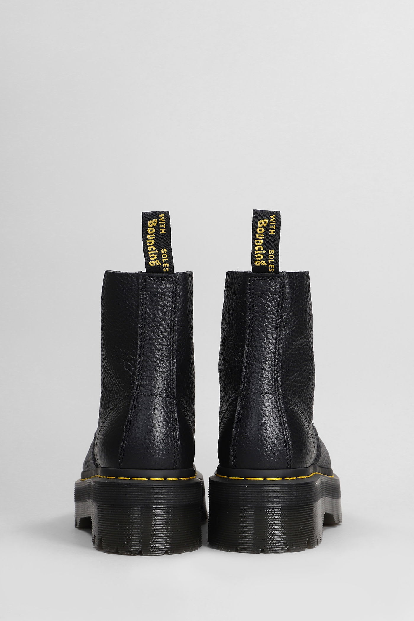 Dr. Martens Sinclair Combat Boot In Black Hammered Leather With A Large Treaded Sole In Animal Print