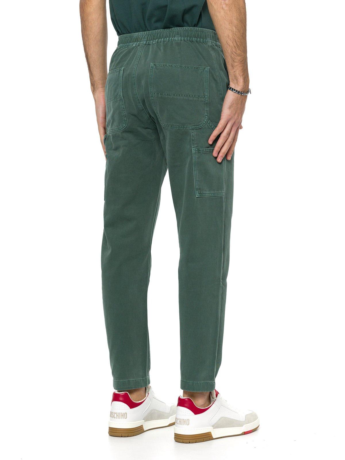 Shop Moschino Log Embroidered Tapered Slim-fit Jeans In Verde