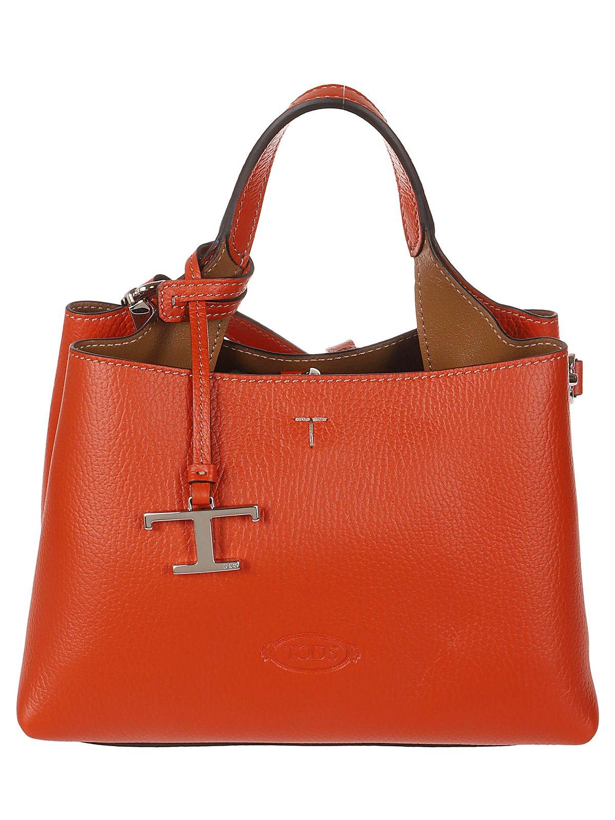 Shop Tod's Logo Embossed Mini Crossbody Bag In Arancio