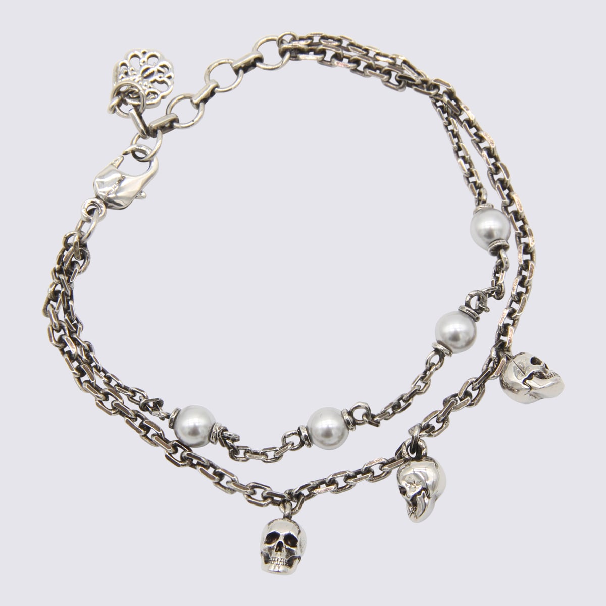 Shop Alexander Mcqueen Silver-tone Metal Skull Bracelet In Ottone/perla