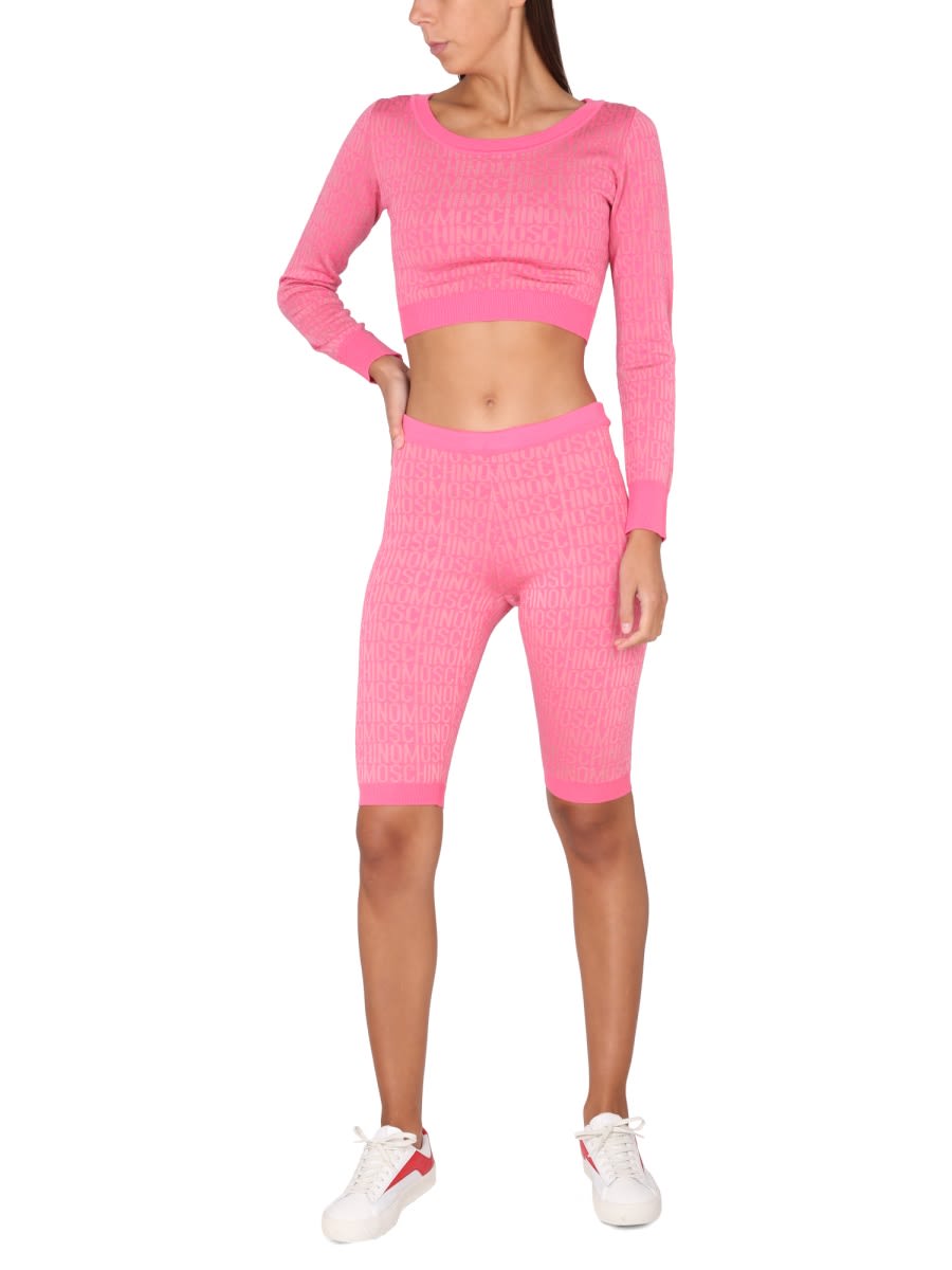 Moschino Cropped Pullover With Allover Logo Pattern In Pink