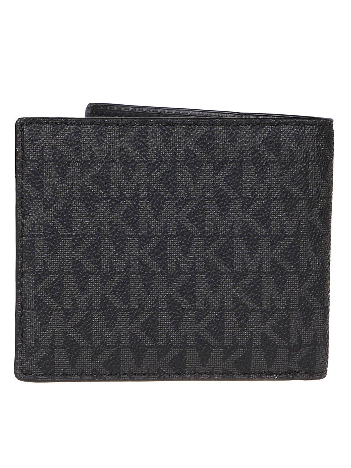Shop Michael Michael Kors Logo Printed Bi-fold Wallet In Black