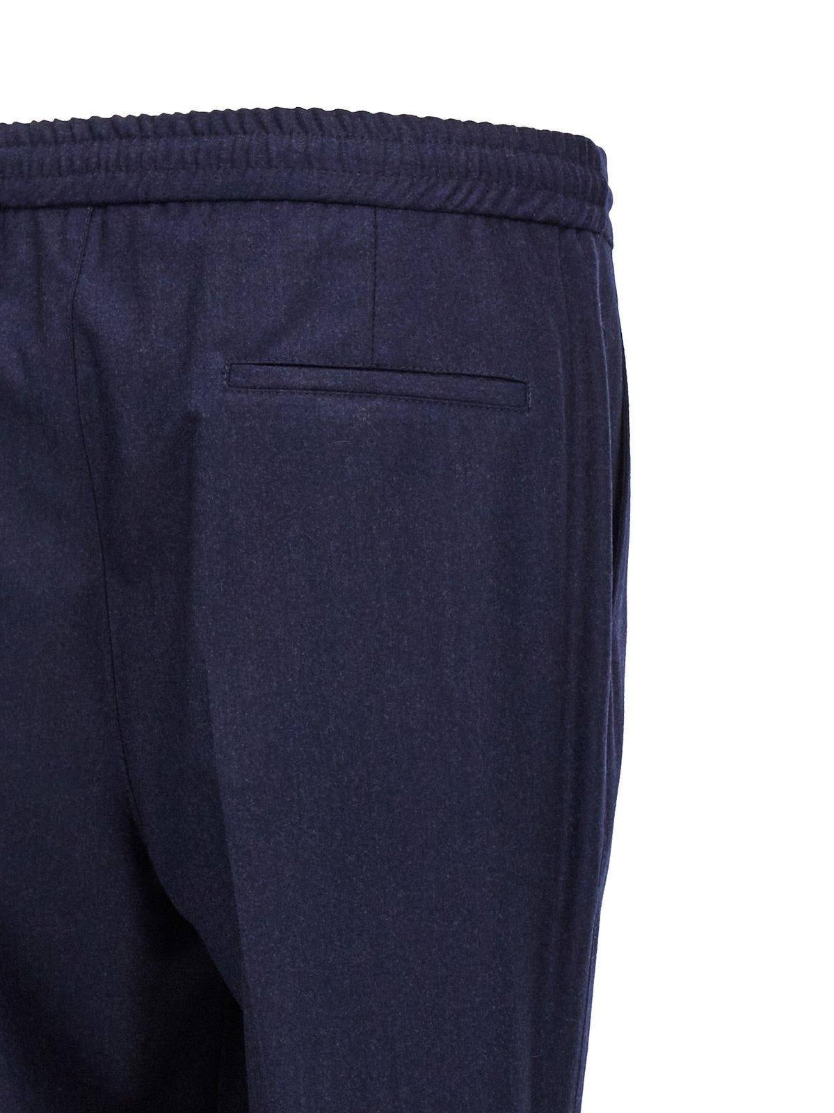 Shop Brunello Cucinelli Pleated Tapered Leg Trousers In Blue