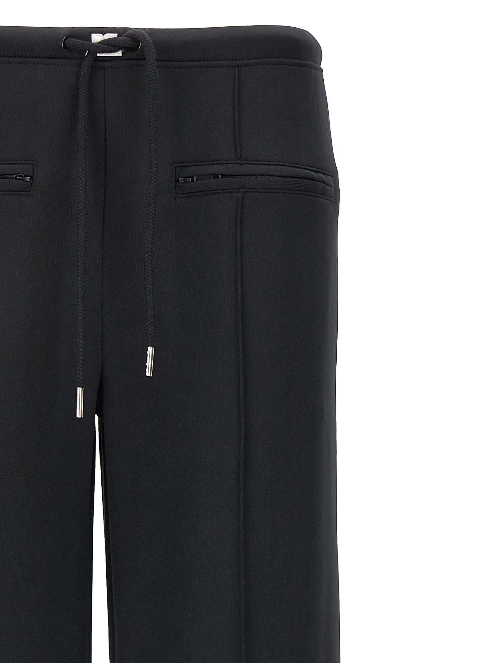 Shop Courrèges Interlock Tracksuit Pants In Black