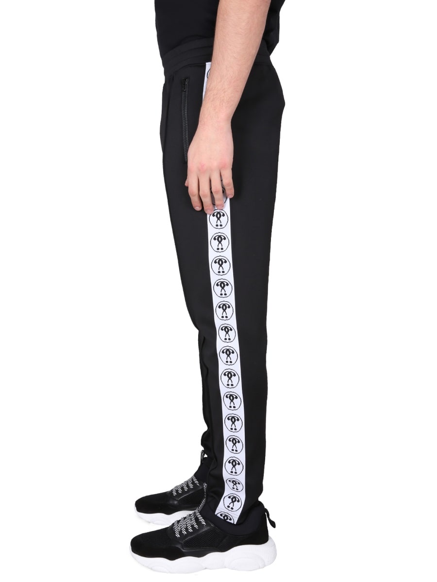Moschino Jogging Pants With Adjustable Drawstring And Zippered Pockets In Black