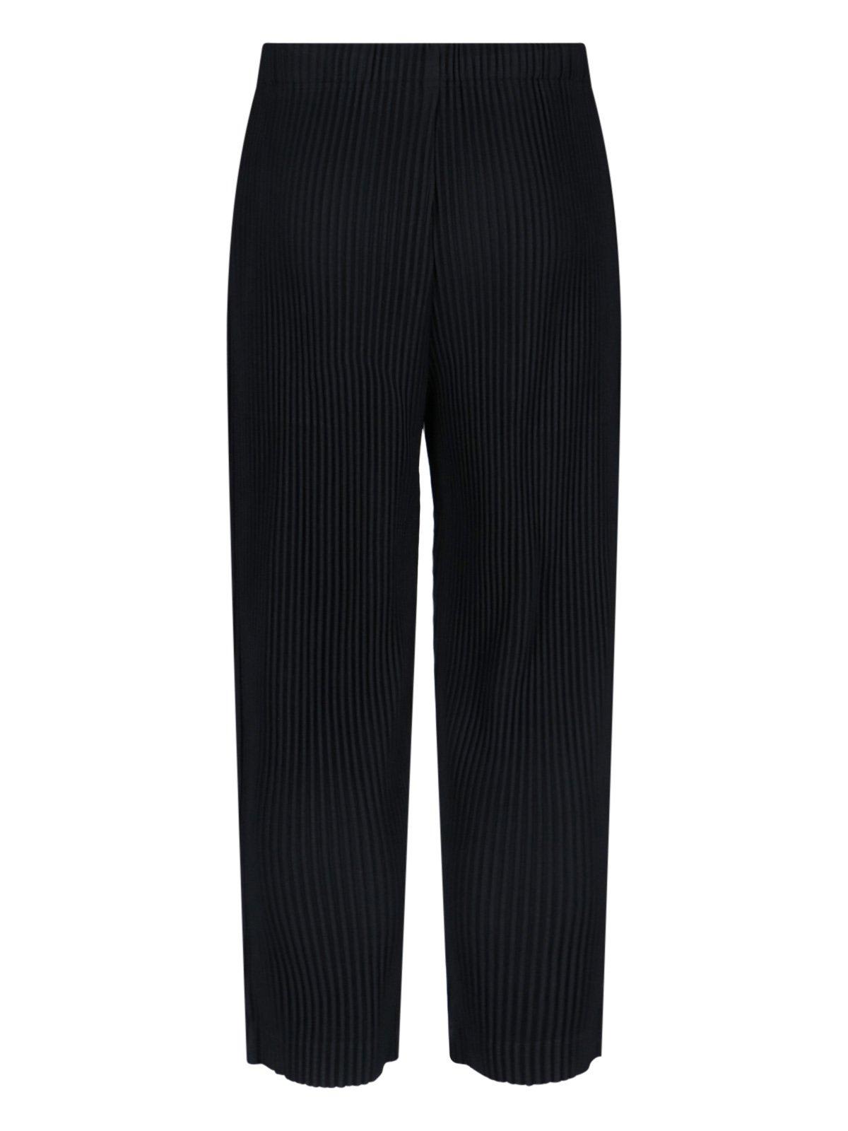 ISSEY MIYAKE PLEATED TAPERED LEG TROUSERS