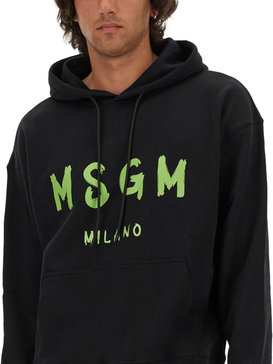 Shop Msgm Logo Printed Drawstring Hoodie In Black