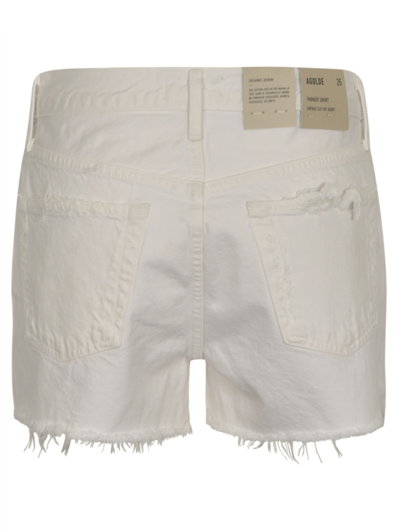 Shop Agolde Distressed Buttoned Denim Shorts In Dough