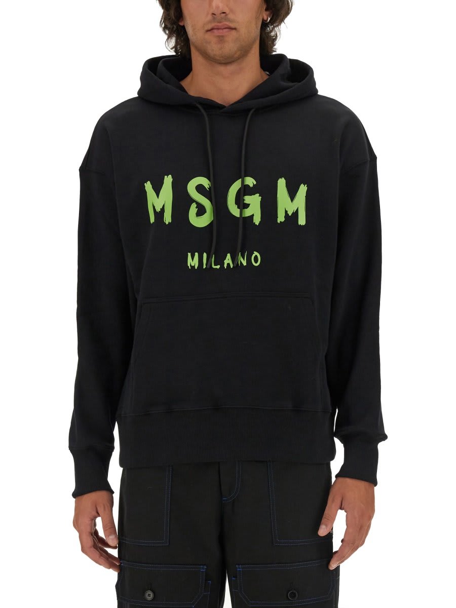 Shop Msgm Logo Printed Drawstring Hoodie In Black