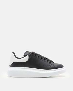 Shop Alexander Mcqueen Oversize Larry Leather Sneakers In Black
