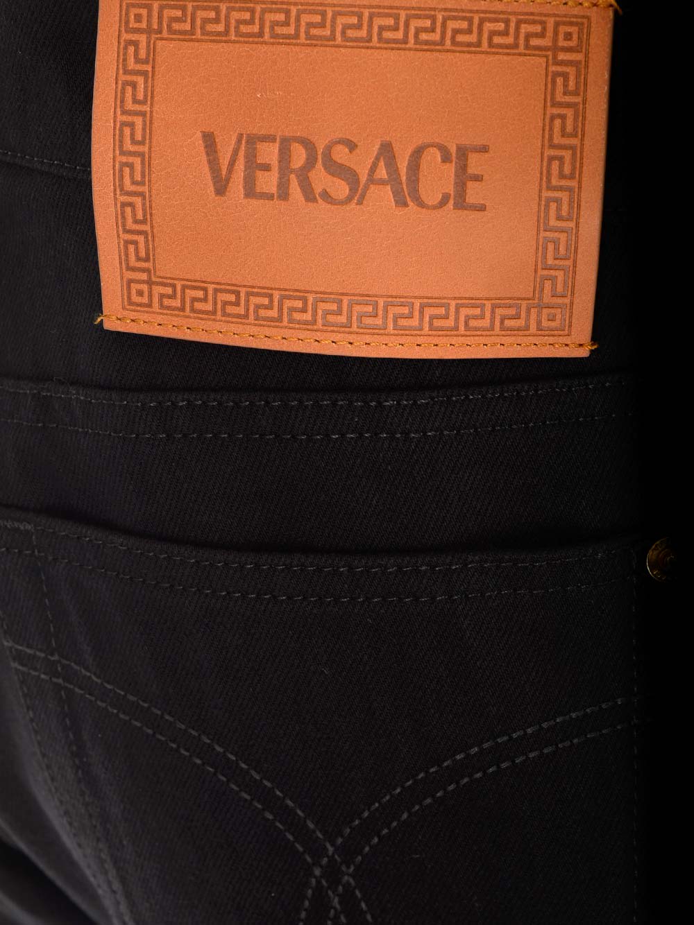 Shop Versace Straight Leg Jeans In Black