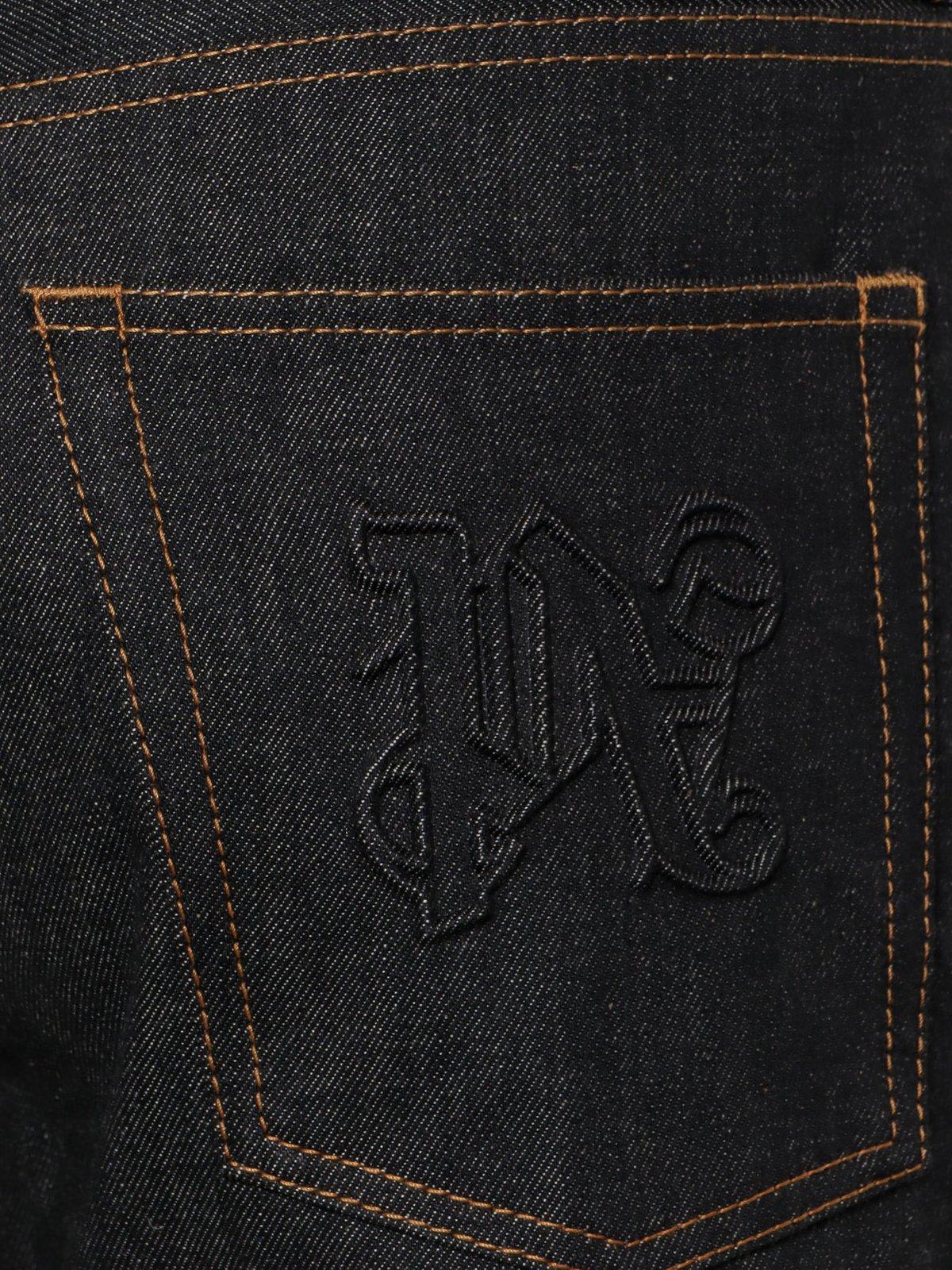 Shop Palm Angels Logo Embossed Straight Leg Jeans In Black