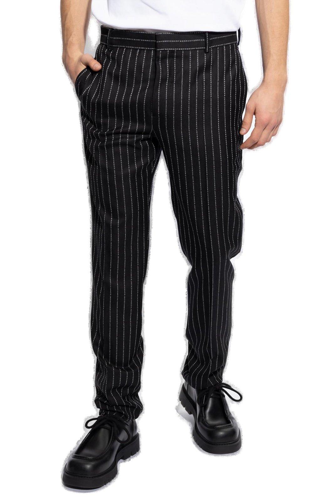 Shop Alexander Mcqueen Pinstriped Peat Front Trousers In Black