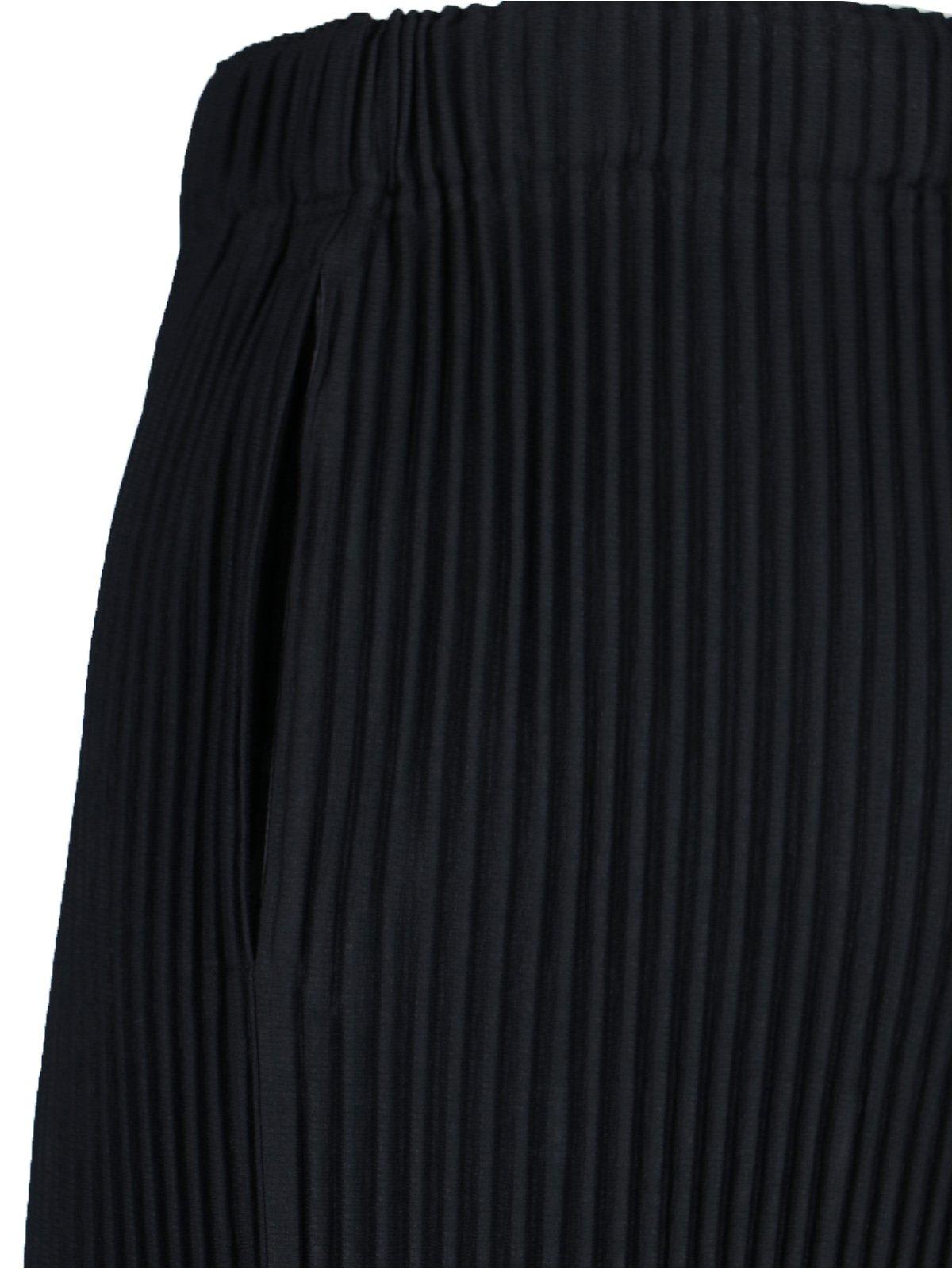 ISSEY MIYAKE PLEATED TAPERED LEG TROUSERS