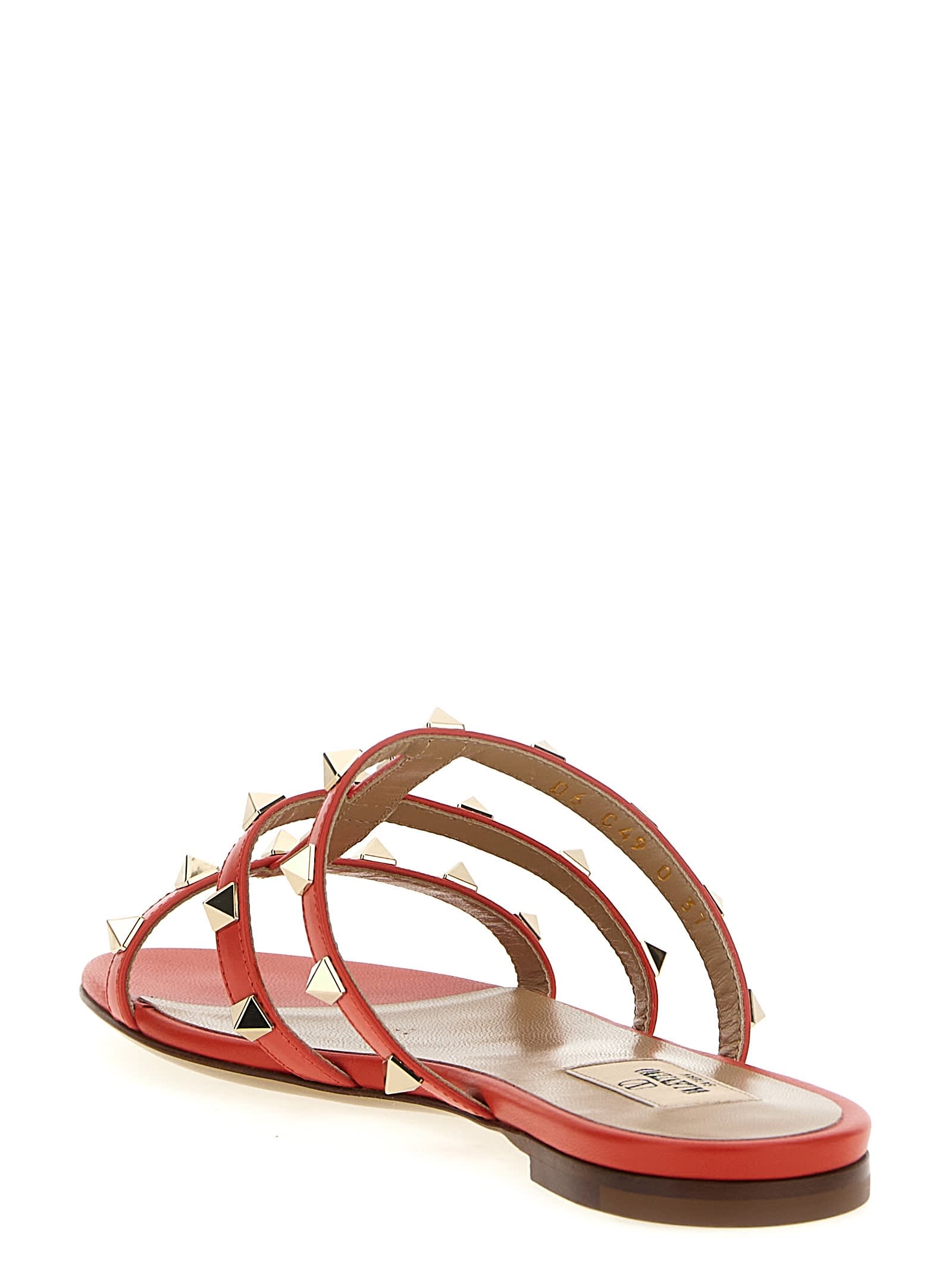 Valentino Rockstud Flat Sole Open Toe Sandals In Red