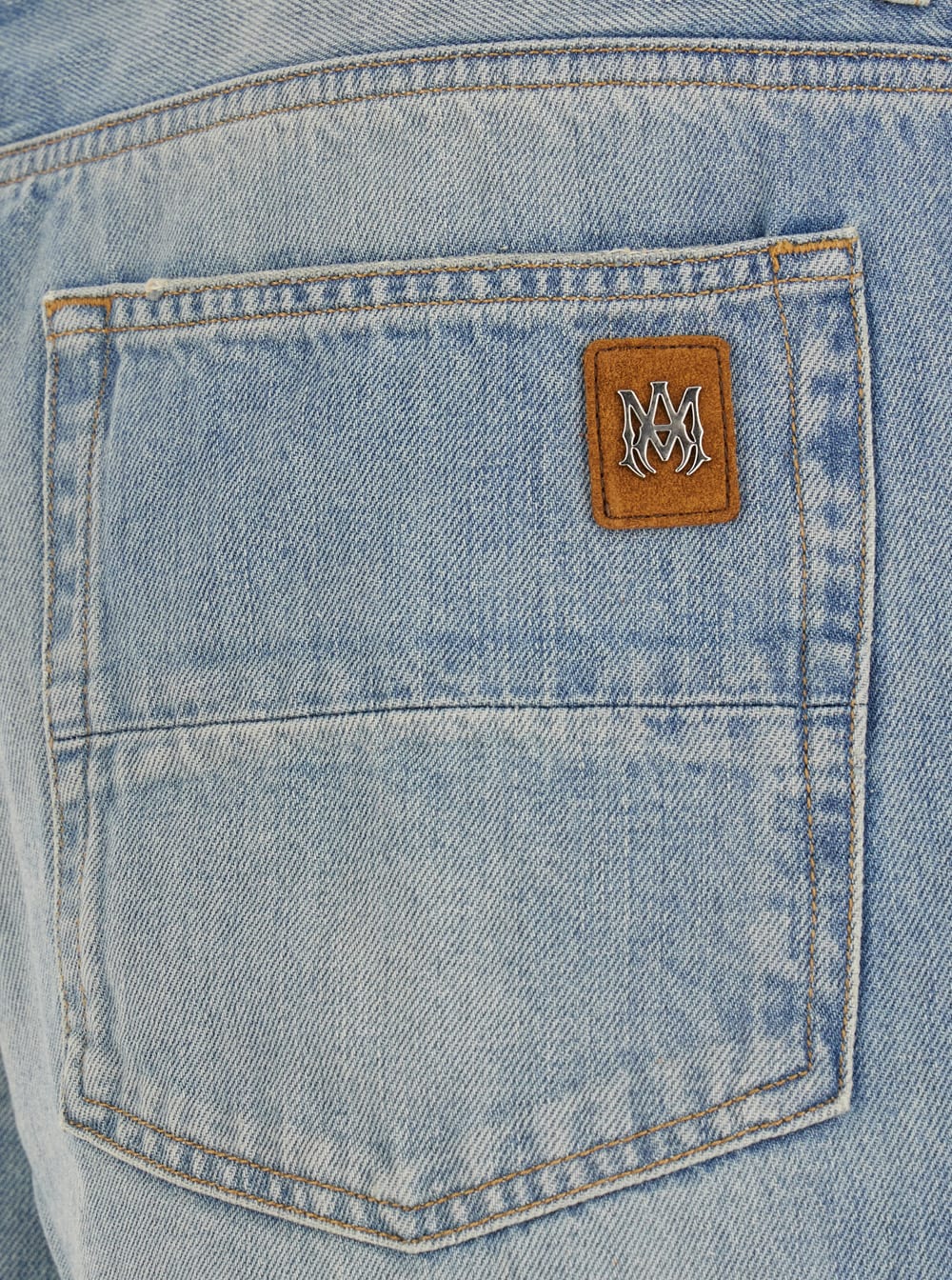 Amiri Light Blue Jeans With Flared Leg And Logo Patch On The Rear In Blue