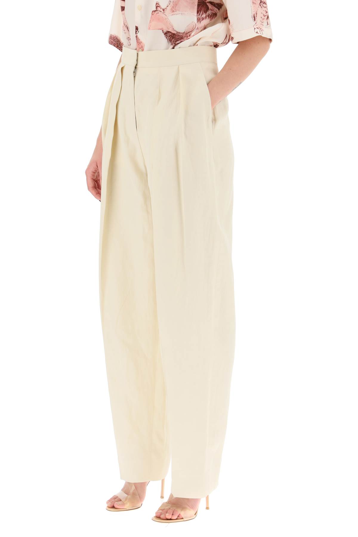 Shop Stella Mccartney Loose Linen Blend Pants With Front Pleats In Buttermilk (beige)