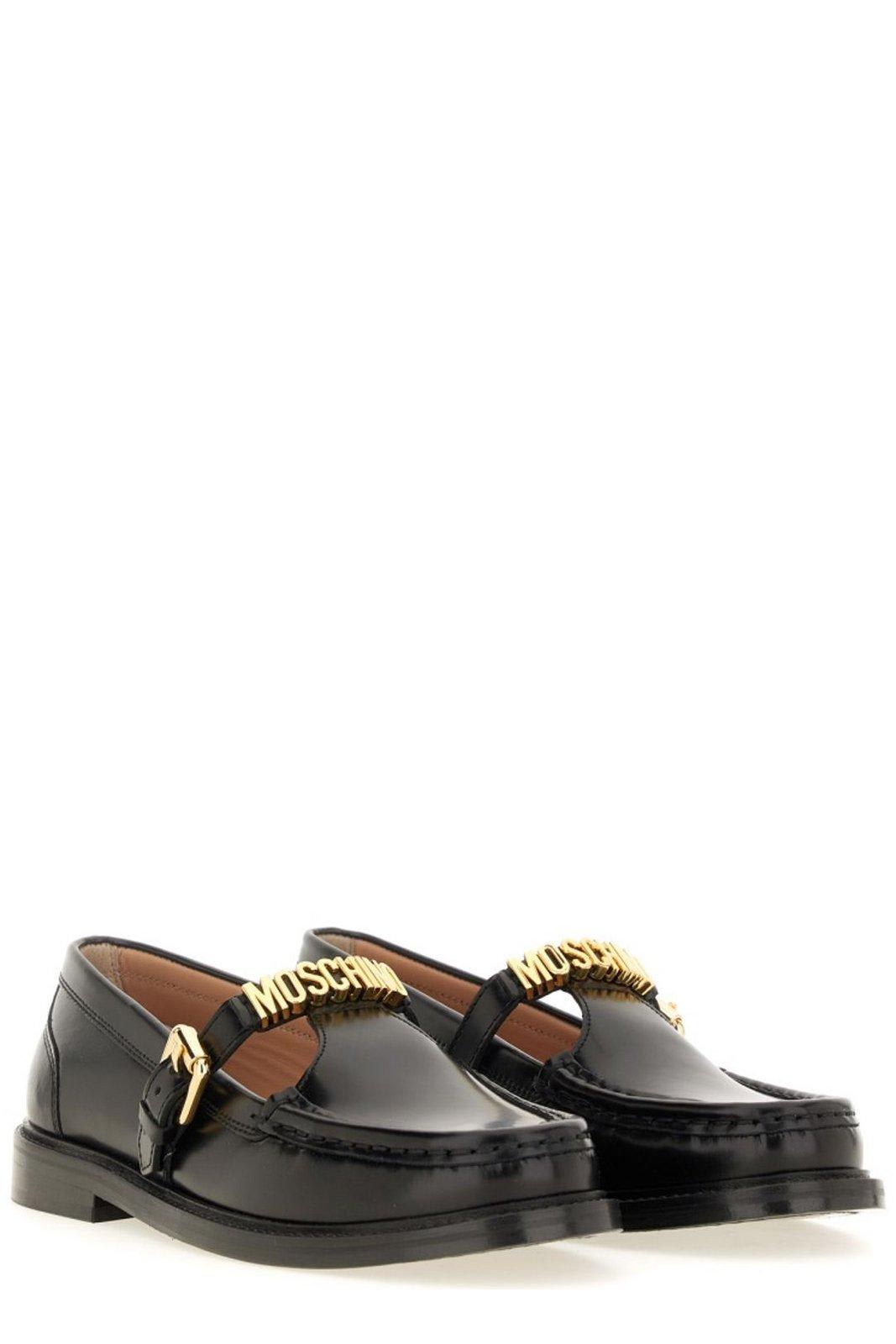 Shop Moschino Logo Lettering Slip-on Loafers In Black