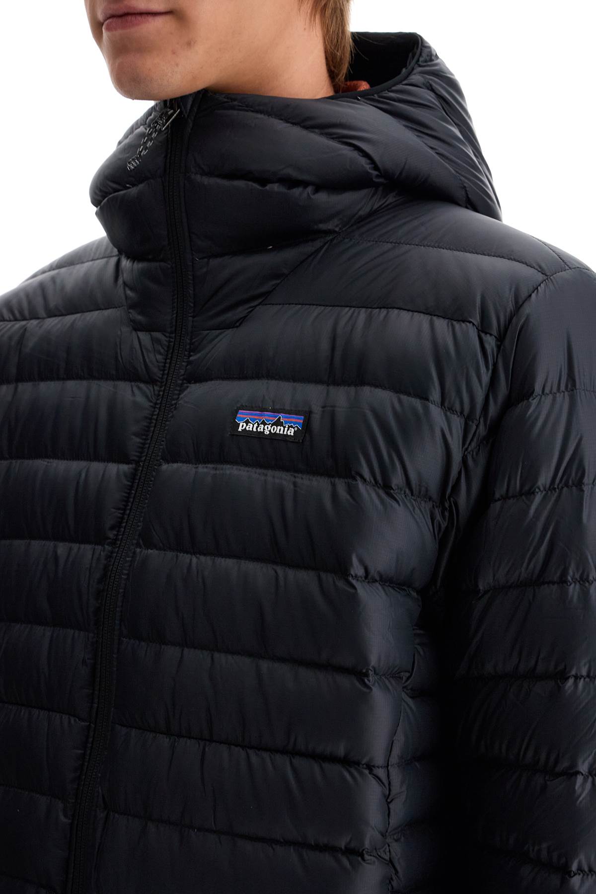 Shop Patagonia Down-filled Hooded Sweater In Black (black)