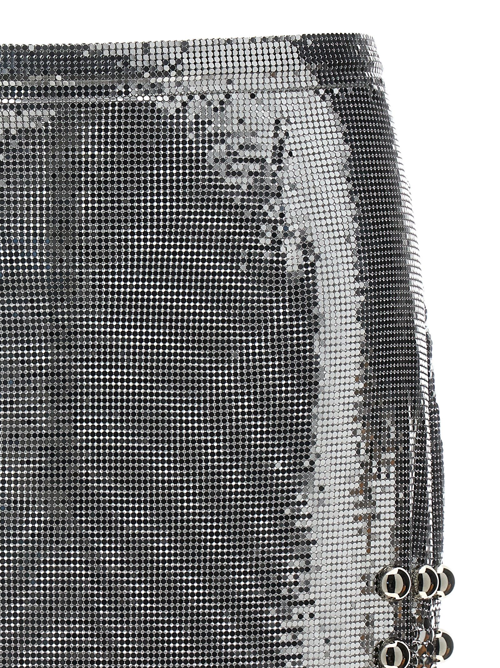 RABANNE SILVER MESH SHORT SKIRT WITH RINGS AND STUDS 