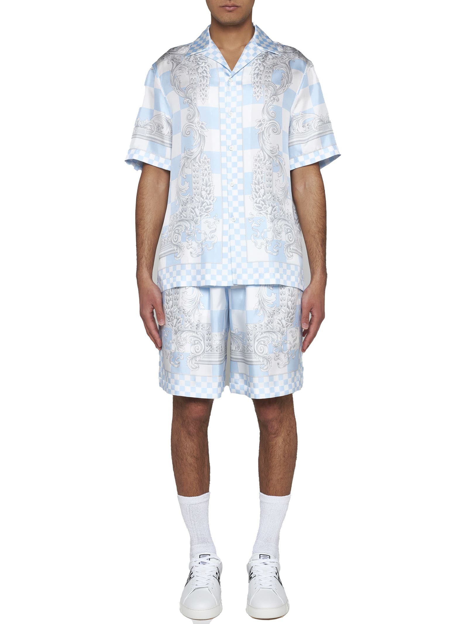 Shop Versace Shorts In Pastel Blue+white+silver