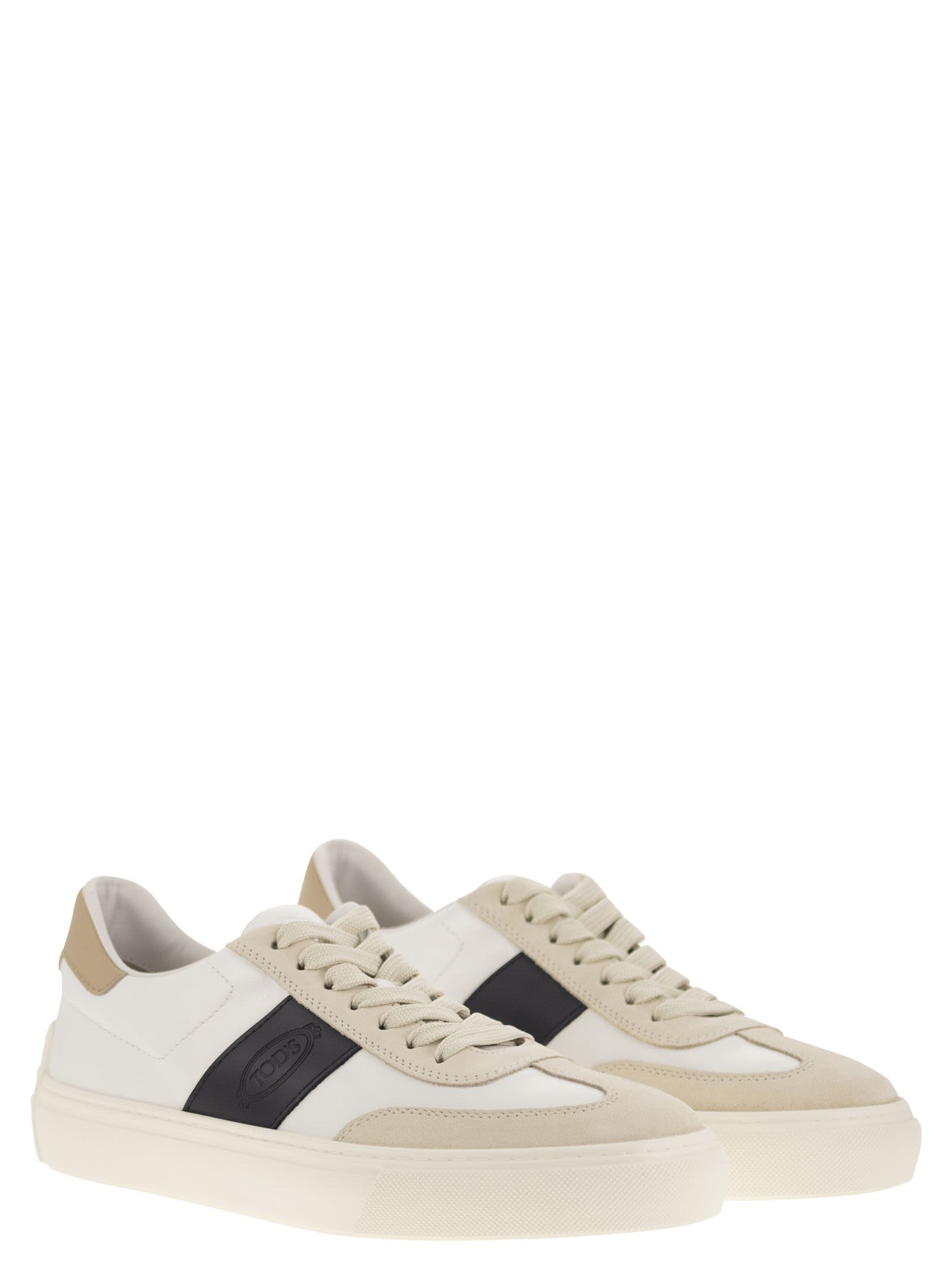 Shop Tod's Leather Sneakers In Milk