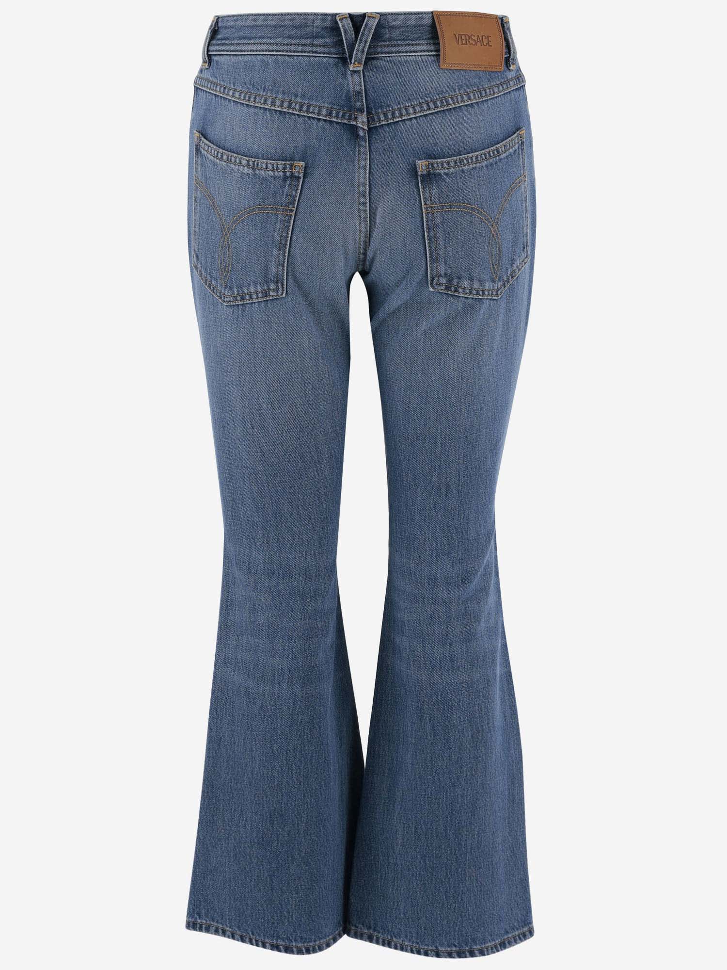 Shop Versace Flexed Jeans In Denim