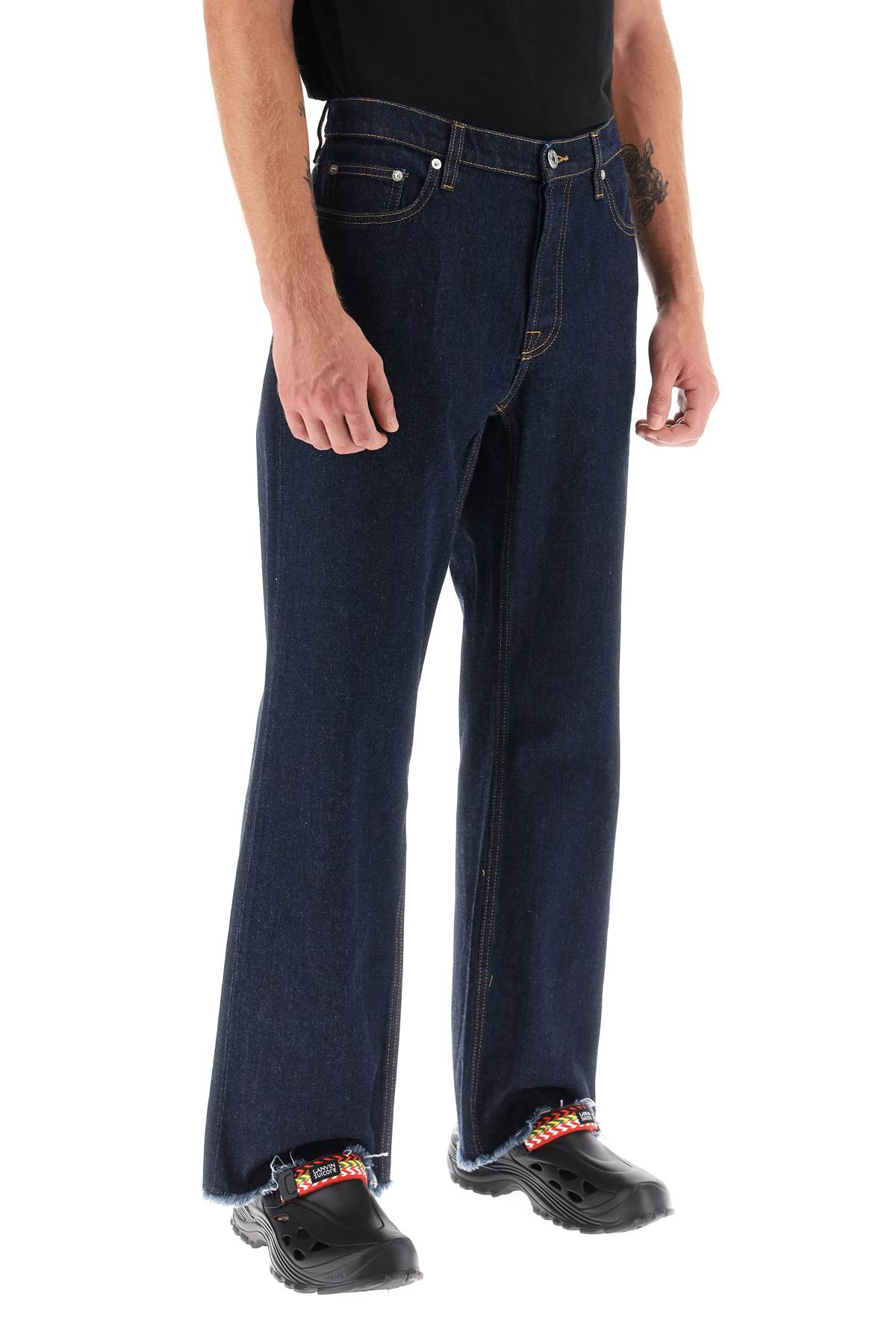 Shop Lanvin Jeans With Frayed Hem In Navy (blue)
