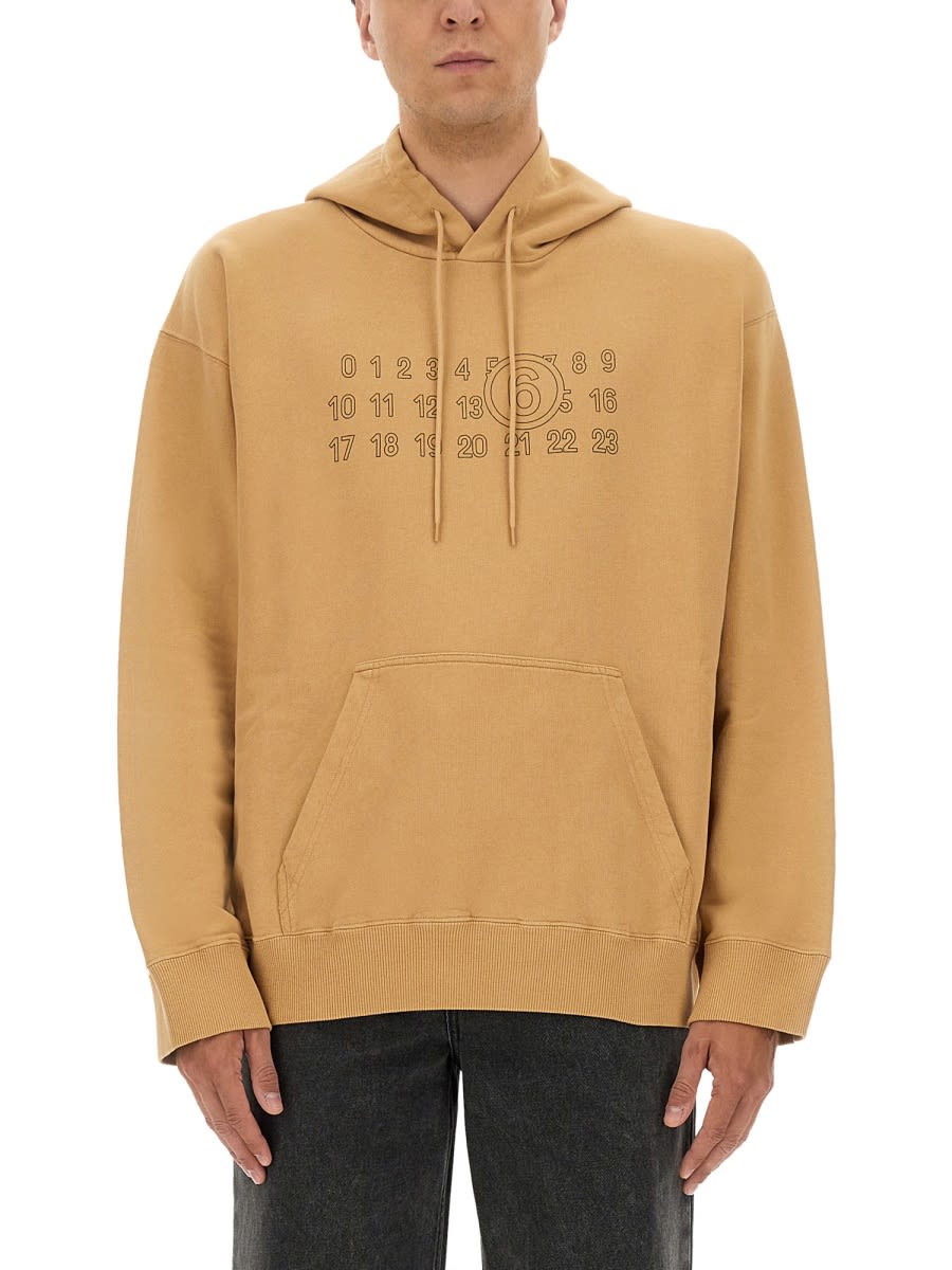 Mm6 Maison Margiela Mm6 By Maison Margiela Relaxed-fit Cotton Hoodie With Unique Graphic Print In Brown