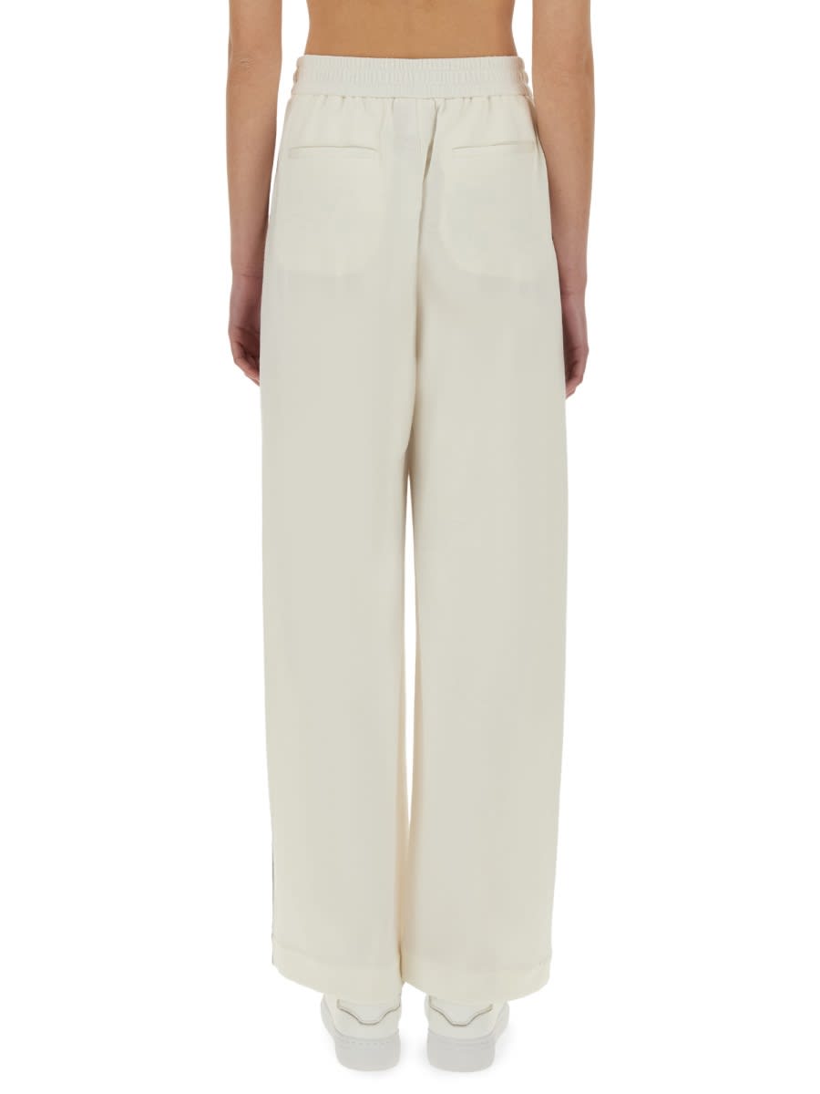 BRUNELLO CUCINELLI TRACK PANTS WITH NECKLACE