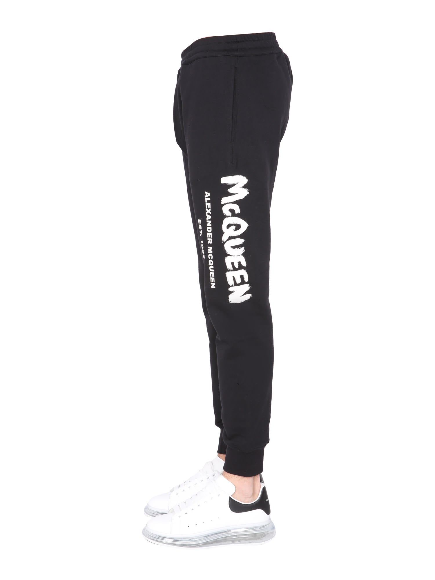 Shop Alexander Mcqueen Jogging Pants With Graffiti Logo In Black/ivory