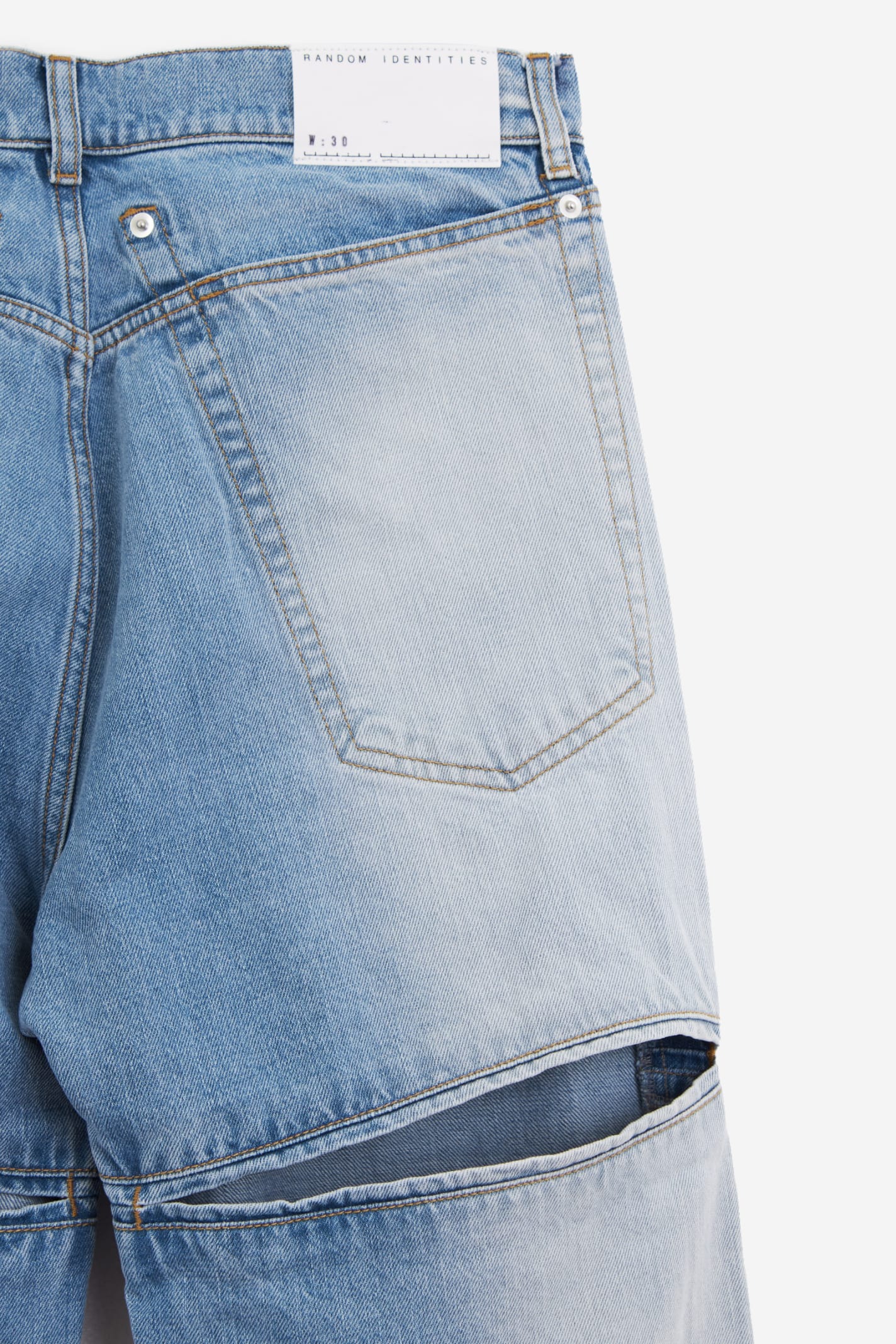 Shop Random Identities Back Cut Denim Jeans In Cyan