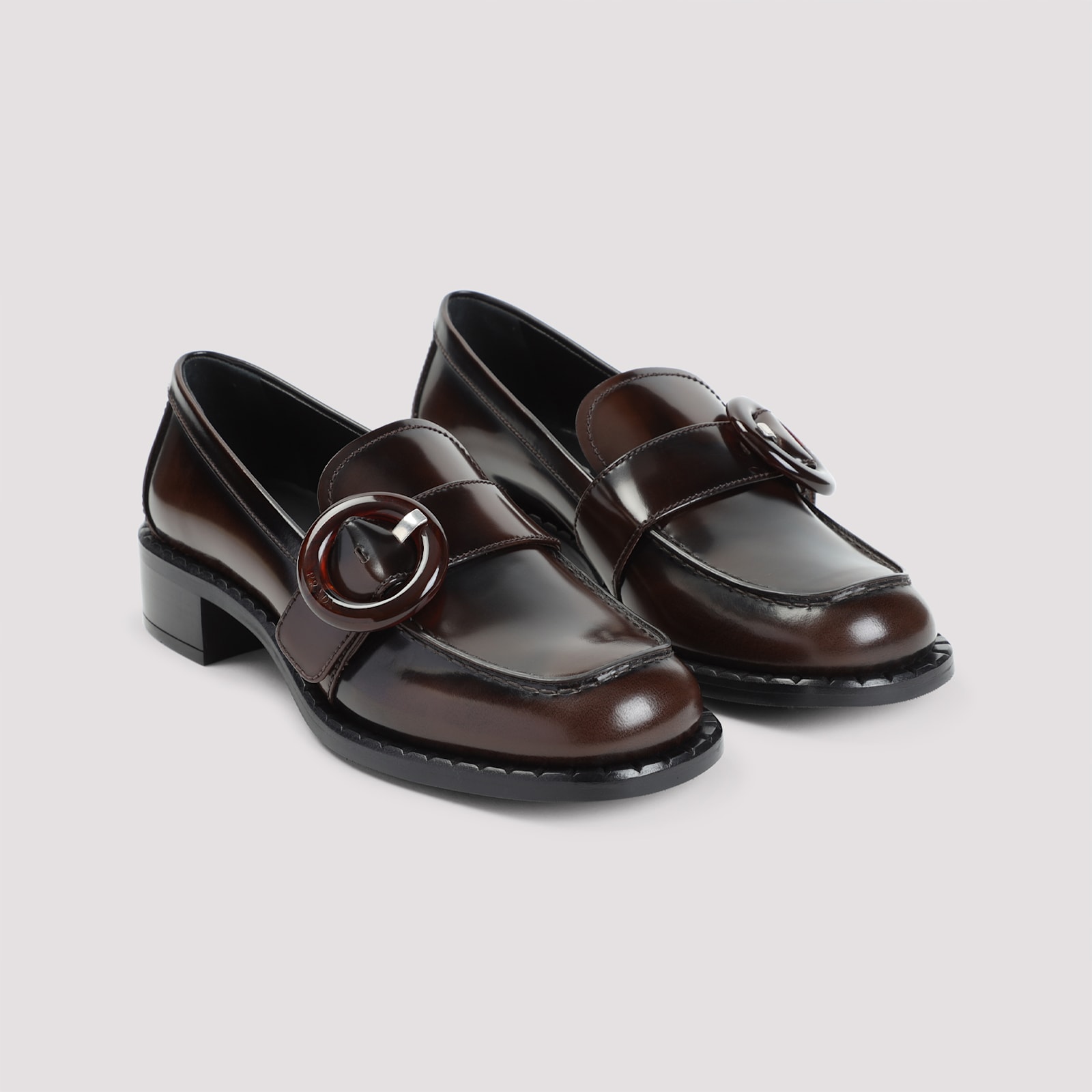 Prada Polished Brown Flat Shoes With Decorative Buckle